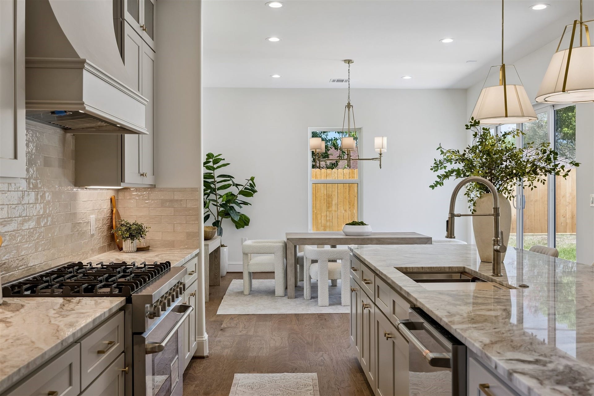Gourmet kitchen with extra large 36" gas range, abundant storage, coffee bar, and breakast bar