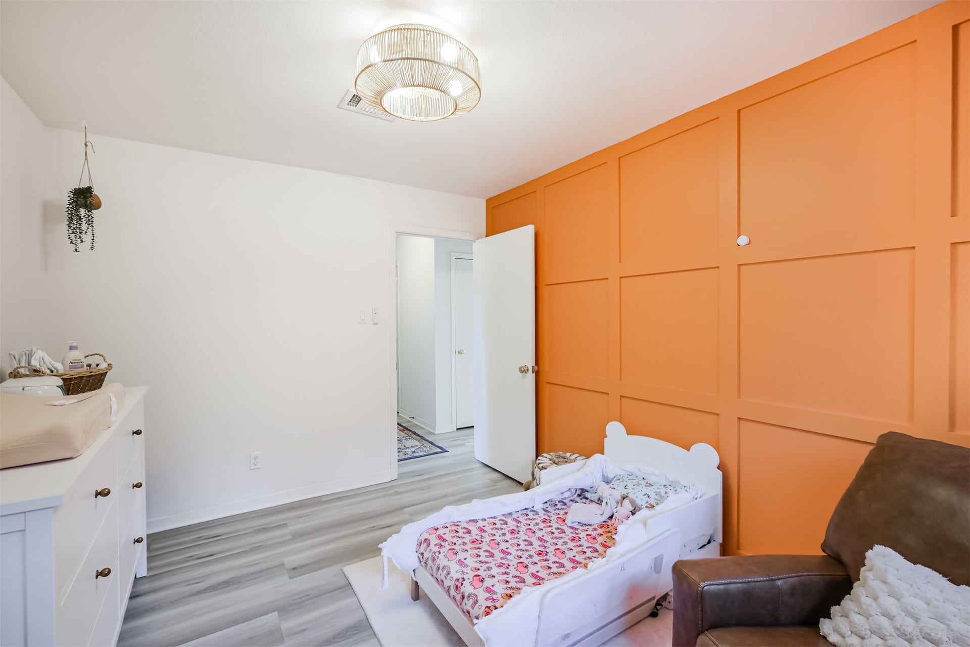 14211 Swiss Hill Drive, Houston, TX 77077 Bedroom #2 has laminate floors and an updated light fixture.