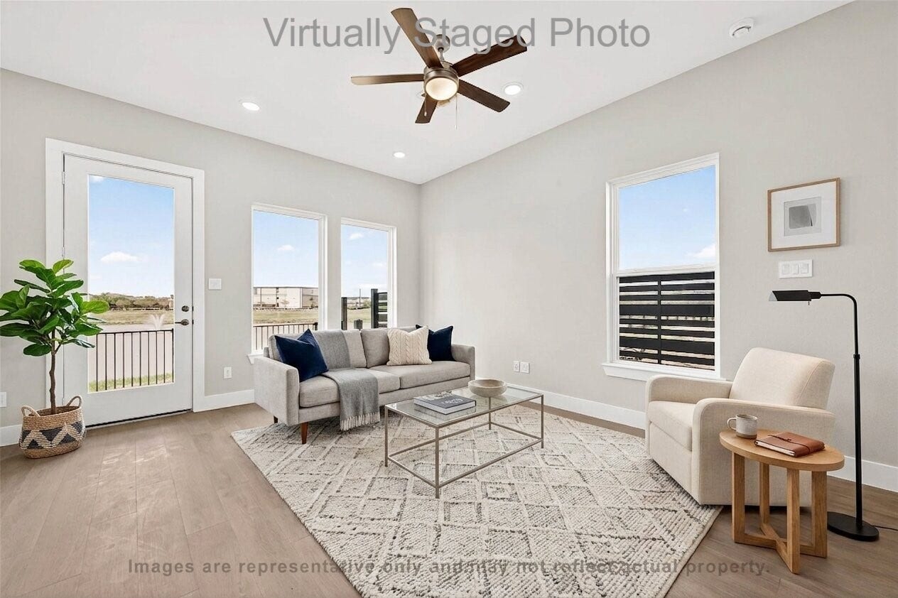 10719 Mason Rd, #32, Richmond, TX 77406 Virtual Staging - Modern living room featuring neutral-toned furniture, a glass coffee table, and large windows that let in plenty of natural light