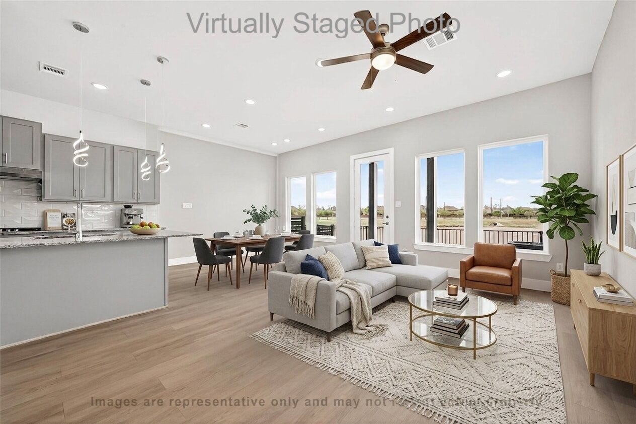 10719 Mason Rd, #32, Richmond, TX 77406 Virtual Staging - Modern kitchen featuring gray cabinetry, a geometric white tile backsplash, and an open layout leading into a sunlit dining area