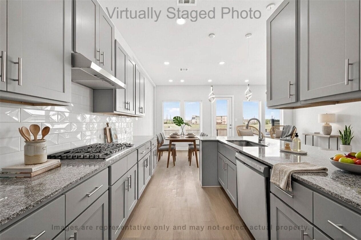 10719 Mason Rd, #32, Richmond, TX 77406 Virtual Staging - Modern kitchen featuring gray cabinetry, granite countertops, and an open layout flowing into a sunlit dining area with large windows
