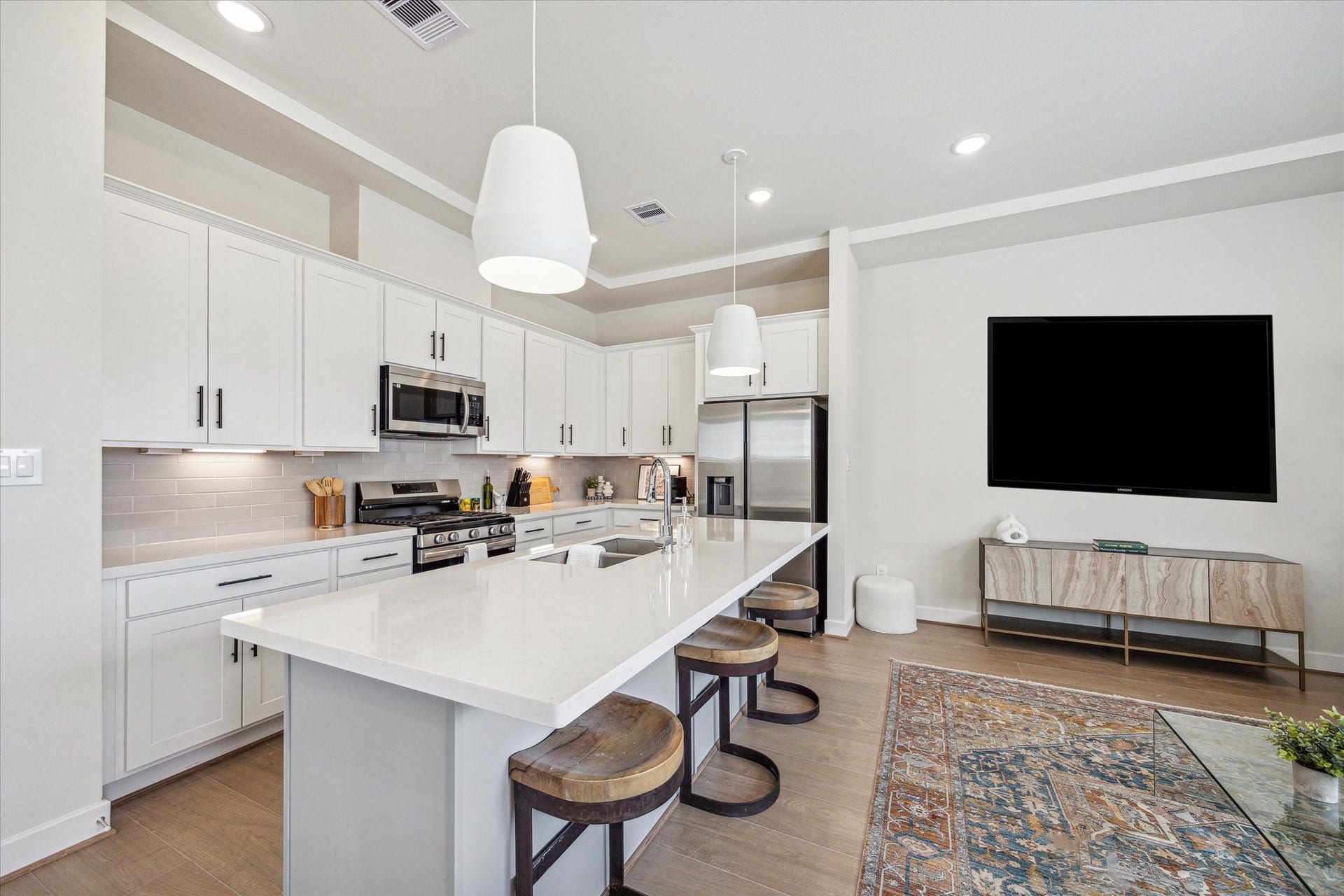 24405 Colonial Willow Drive, Katy, TX 77493 Representative photo showing the communitys model home kitchen. Layout and selections may vary.