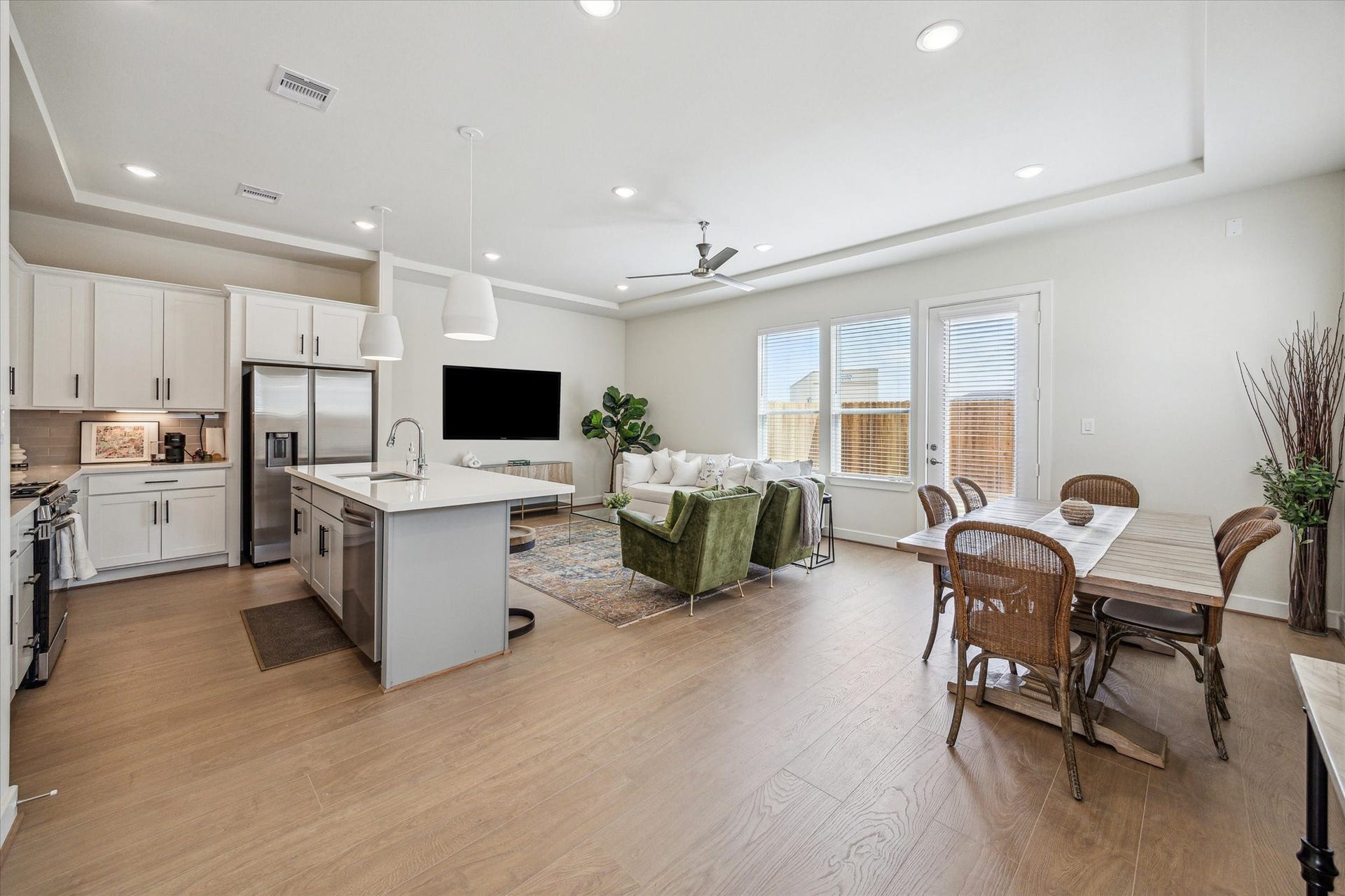 24405 Colonial Willow Drive, Katy, TX 77493 Representative photo showing the communitys model home living room. Layout and selections may vary.
