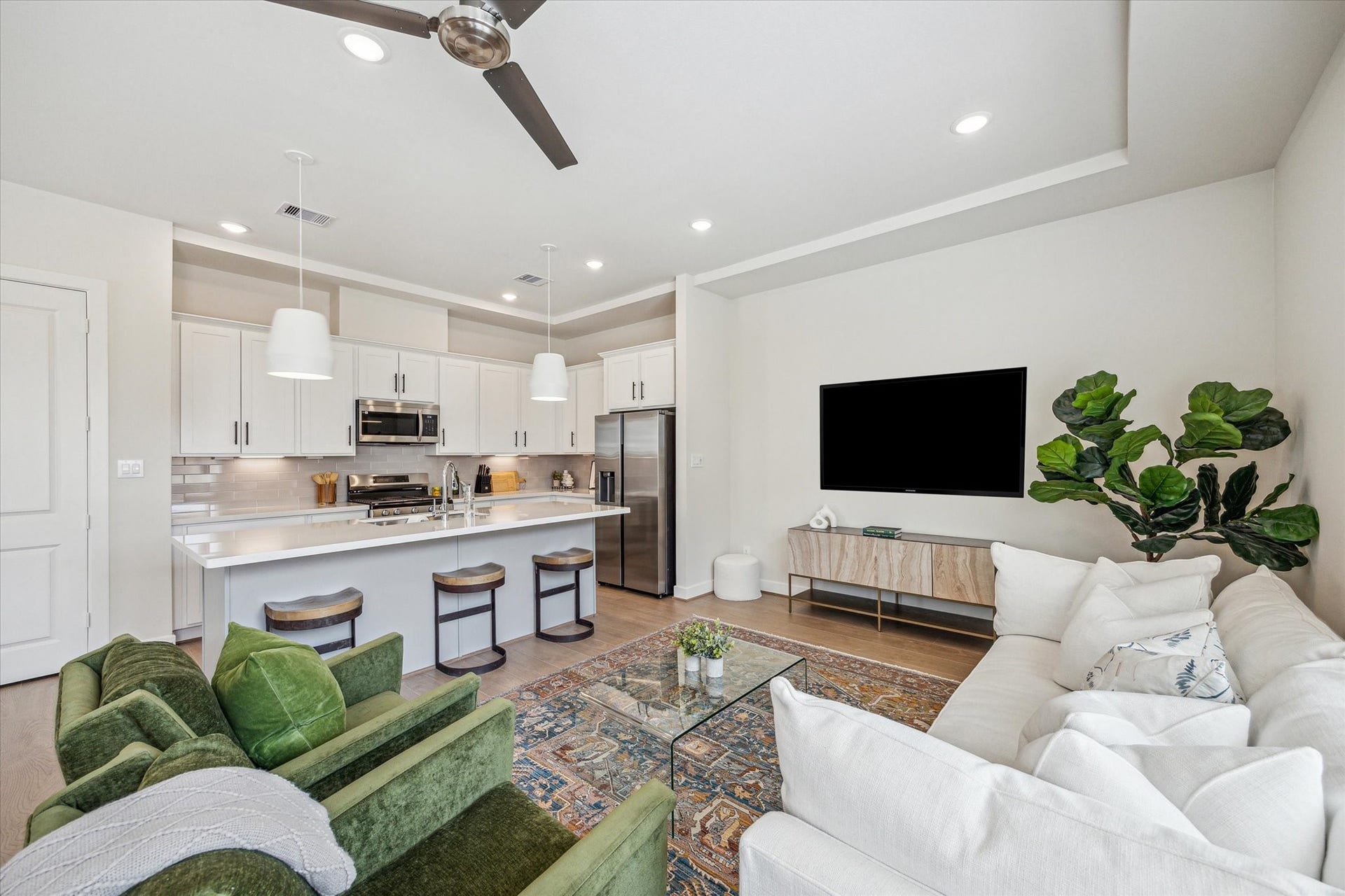 24405 Colonial Willow Drive, Katy, TX 77493 Representative photo showing the communitys model home living room. Layout and selections may vary.