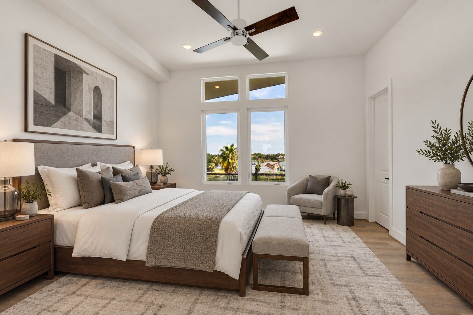 119 Kirby Road, #5303, Taylor Lake Village, TX 77586 Spacious bedroom with modern furnishings, featuring a large window offering scenic views, elegant decor, and abundant natural light. (Virtually staged room).