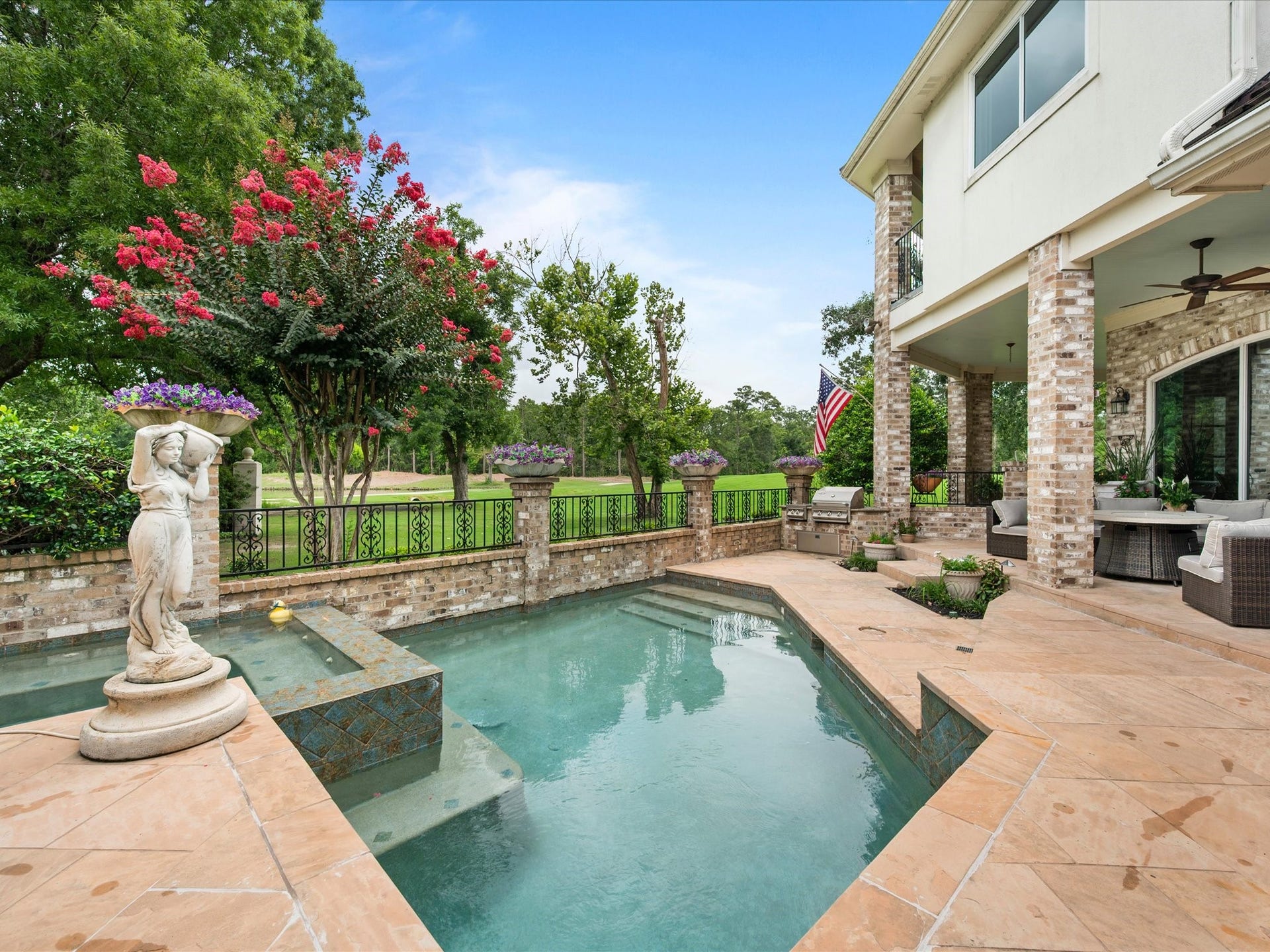 The sparkling pool and spa create a private outdoor retreat designed for relaxation, entertaining, and making lasting memories with family and friends.