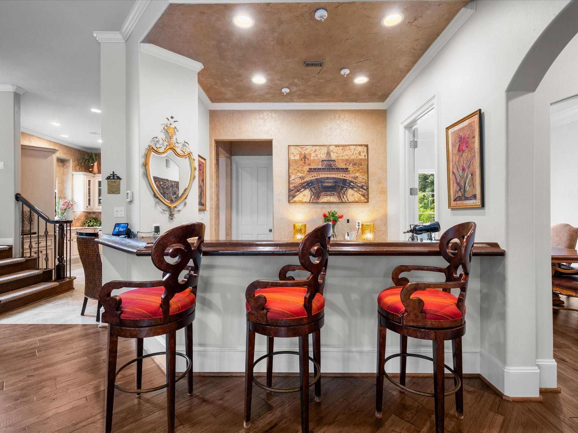 Complete with seating and thoughtfully positioned near the main living spaces, the wet bar adds both convenience and sophistication to everyday living and entertaining.