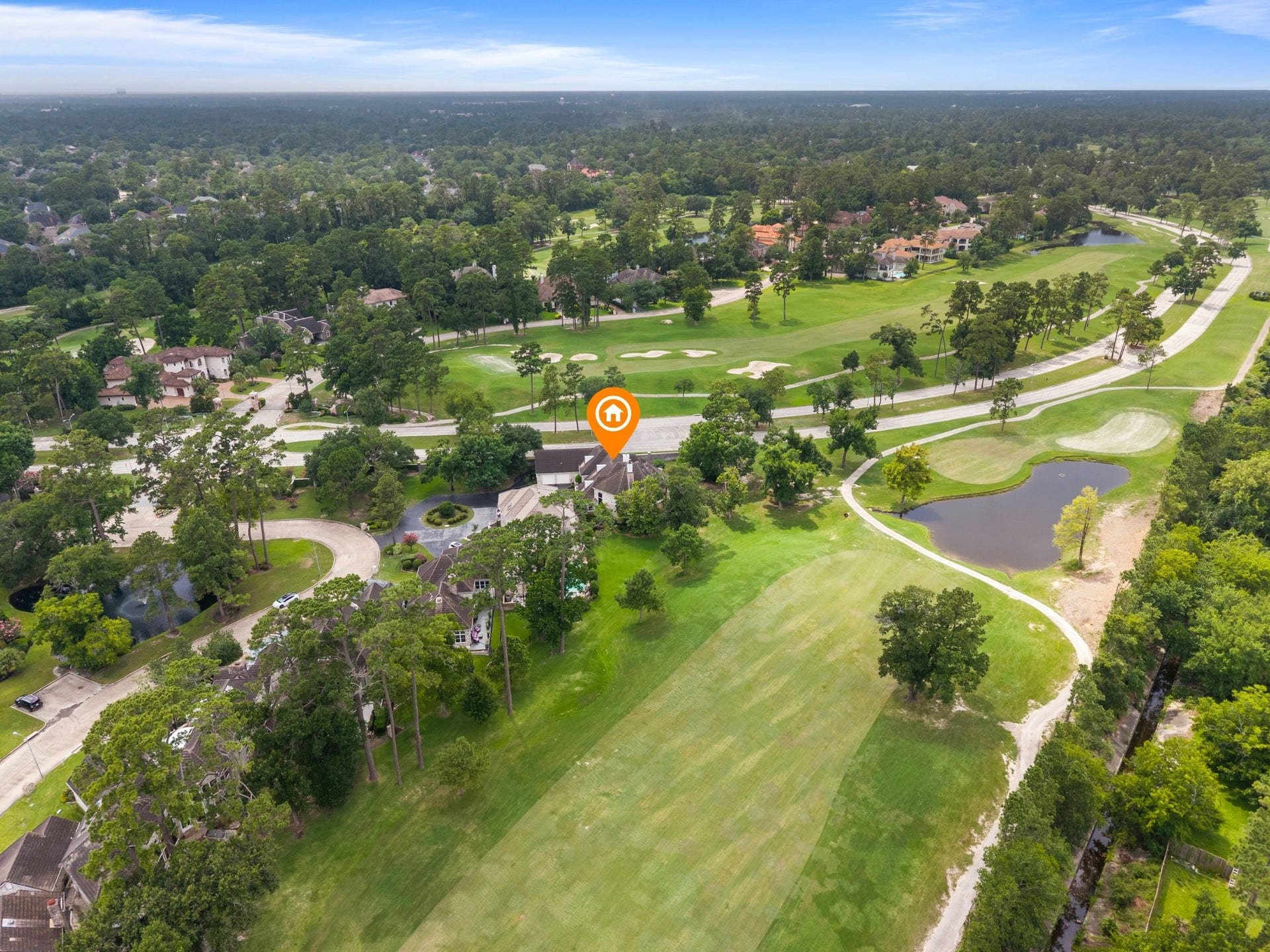 The home is beautifully positioned along Northgate Forest Golf Course, with sweeping fairways stretching behind the property and enhancing its serene, private setting.