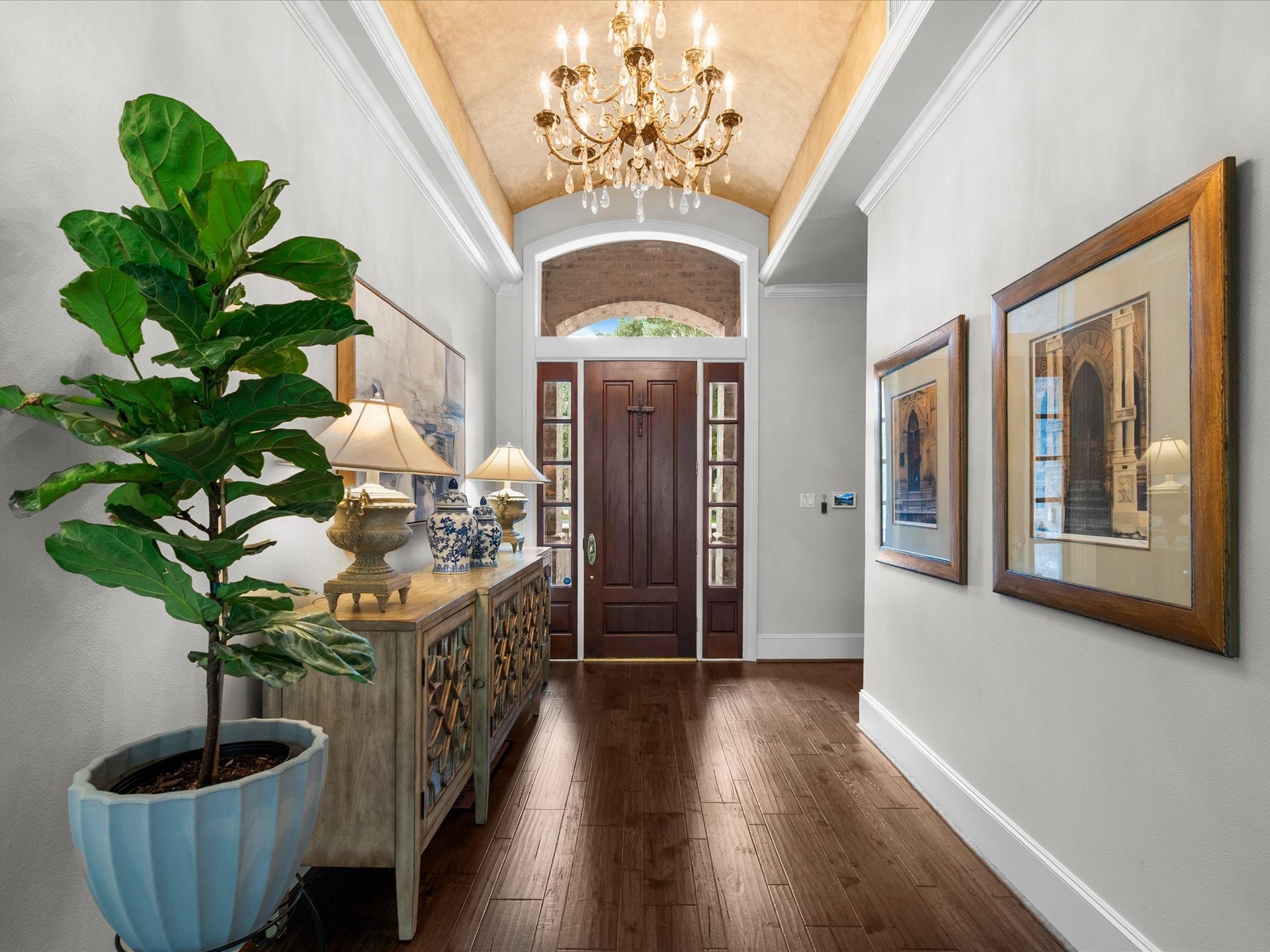 Recently installed engineered hardwood floors add warmth, sophistication, and timeless style while seamlessly connecting the home's gracious living spaces.