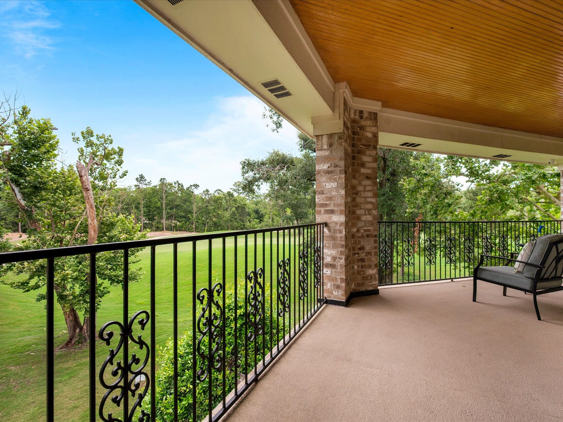 Peaceful mornings and spectacular sunsets await on the expansive balcony, where sweeping fairway views provide a breathtaking backdrop for outdoor relaxation.