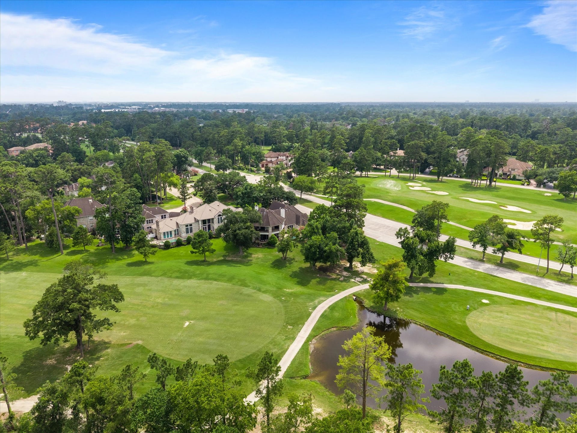 Perfectly positioned along the fairways, the home's stunning rear elevation overlooks the golf course and tranquil pond, offering an extraordinary backdrop for everyday living.