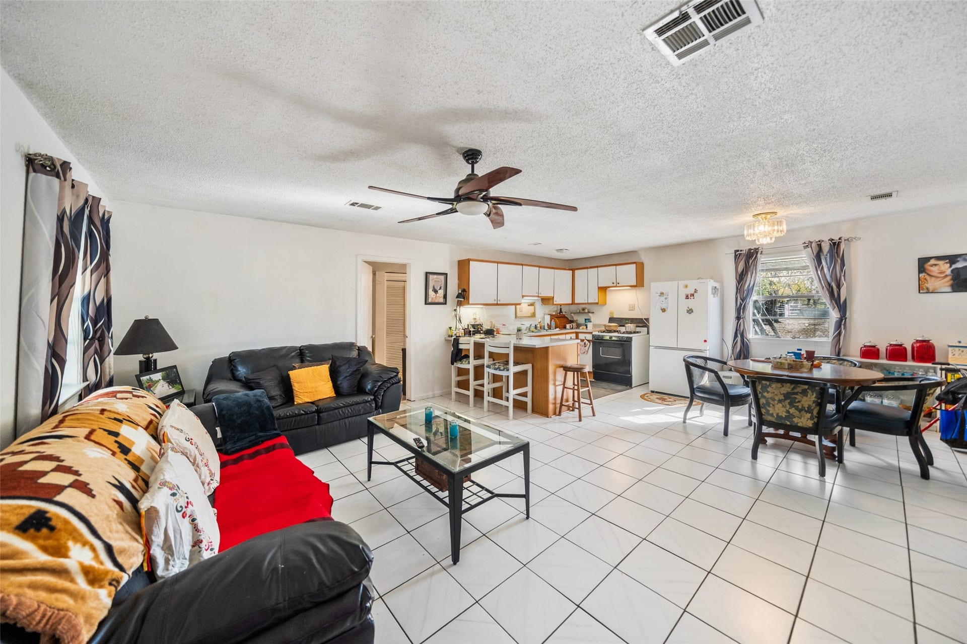 1227 Ave L, Santa Fe, TX 77510 Upon entering, you will notice the open concept living, dining and kitchen. Great use of space