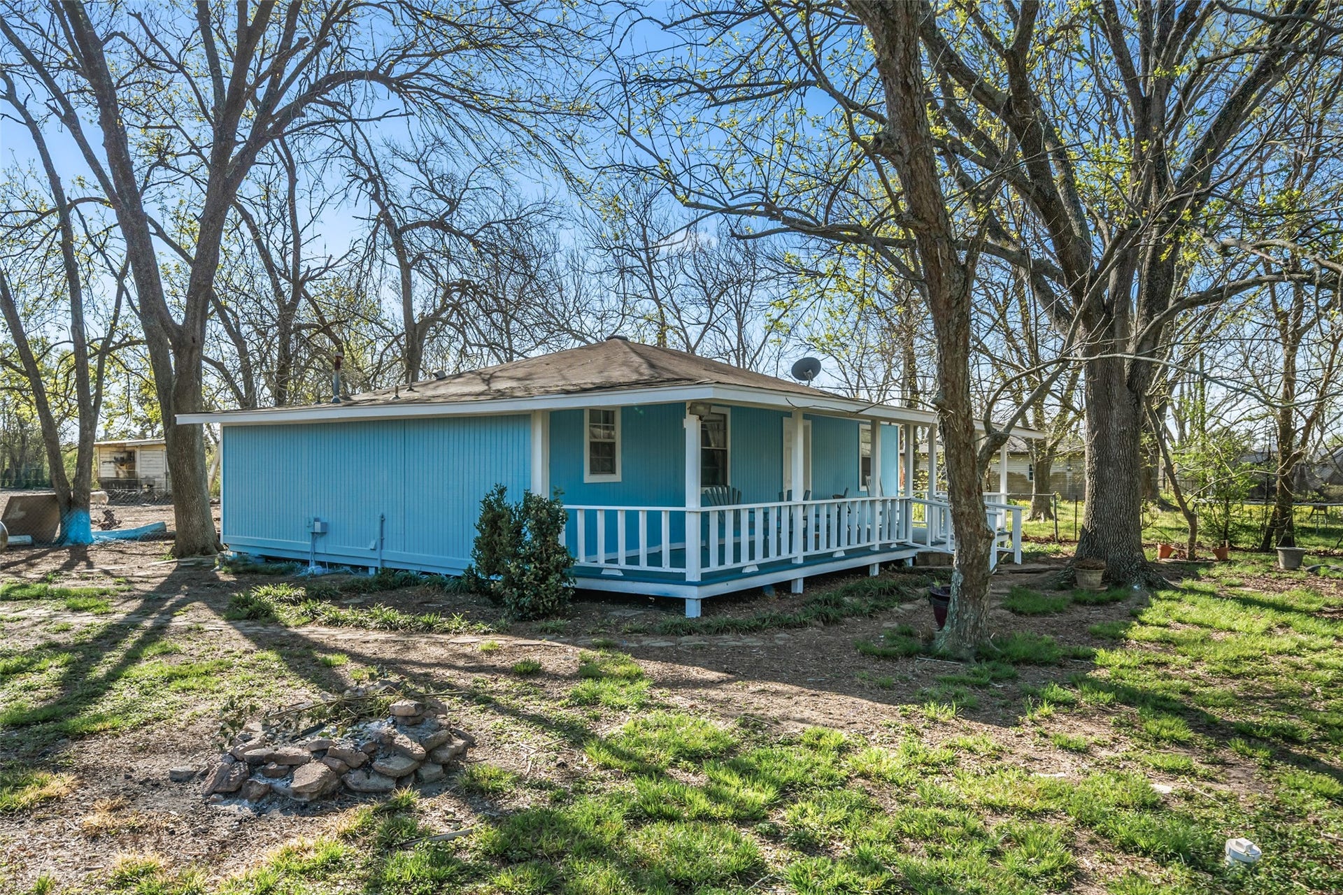 1227 Ave L, Santa Fe, TX 77510 Side angle of house showing lots of trees