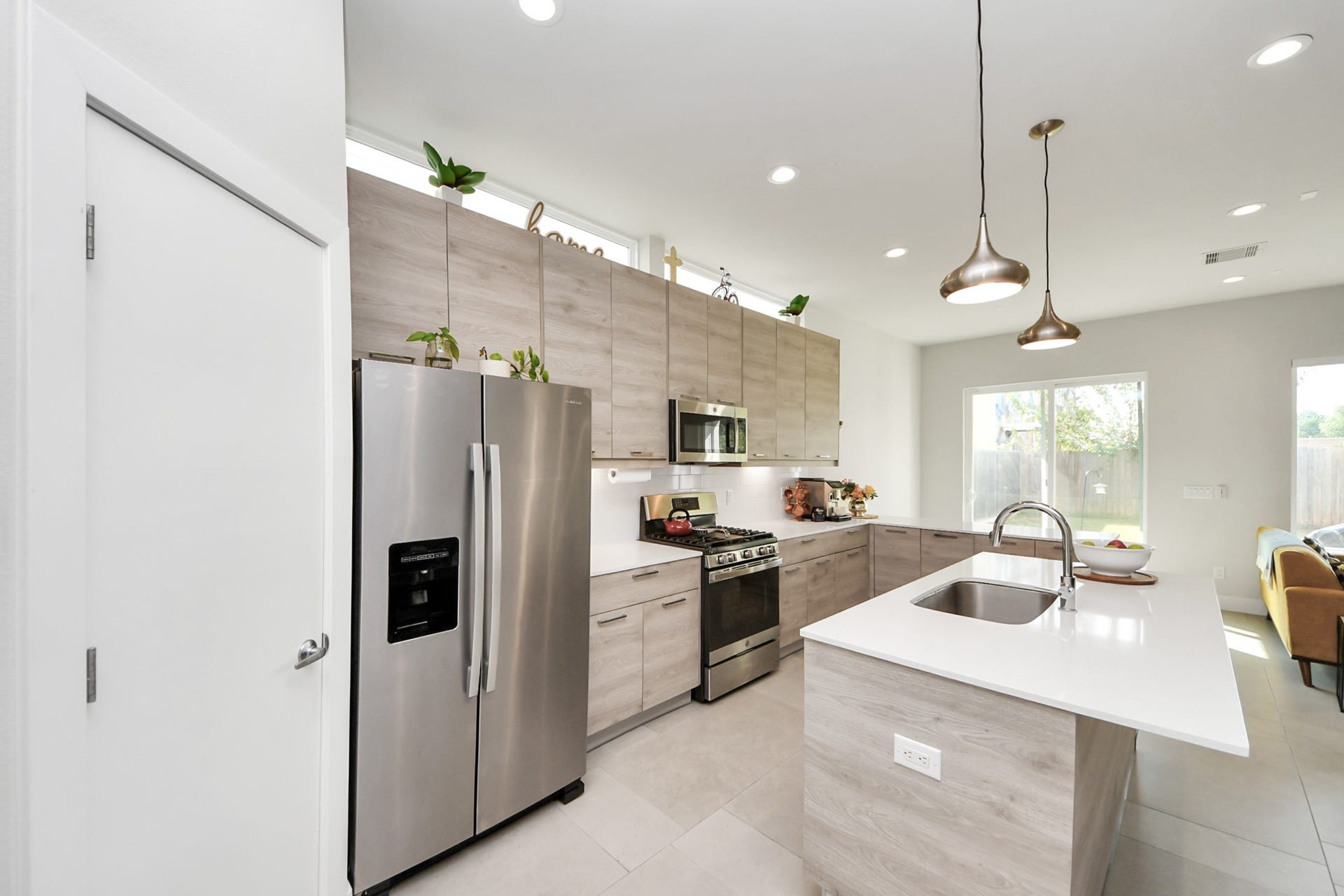 4912 Noble Street, Houston, TX 77020 open concept kitchen with stainless steel fridge