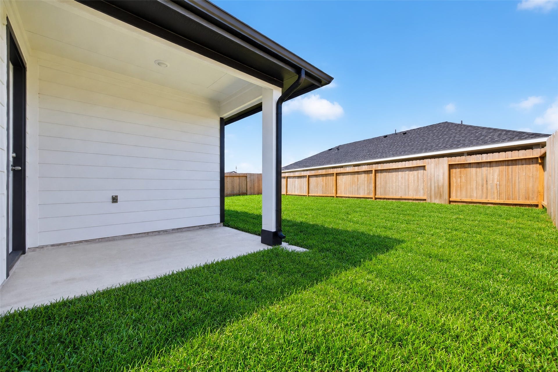 31214 Carmelas Landing Drive, Fulshear, TX 77441 View of covered patio and backyard