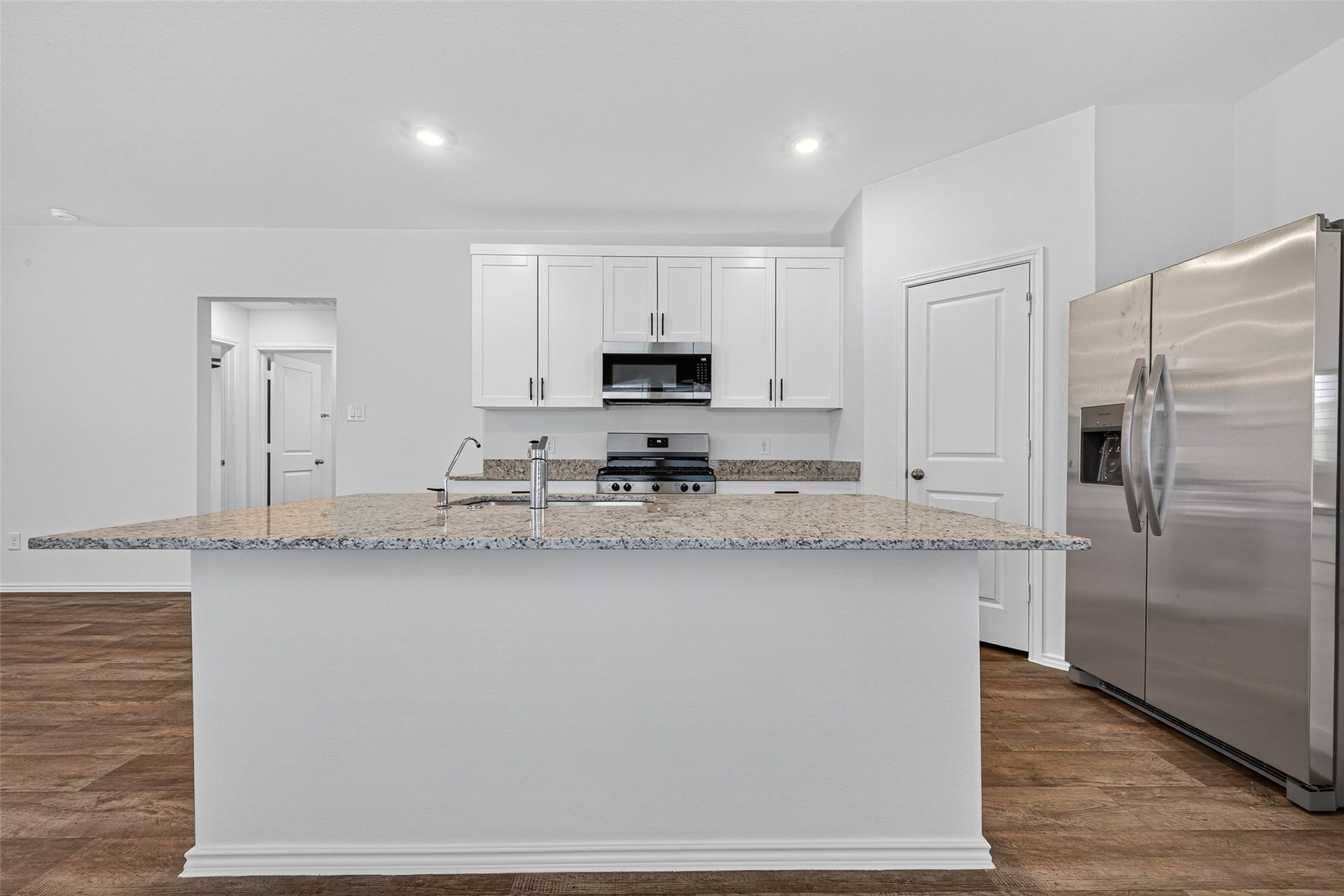 31214 Carmelas Landing Drive, Fulshear, TX 77441 Welcome to the heart of the home, the kitchen