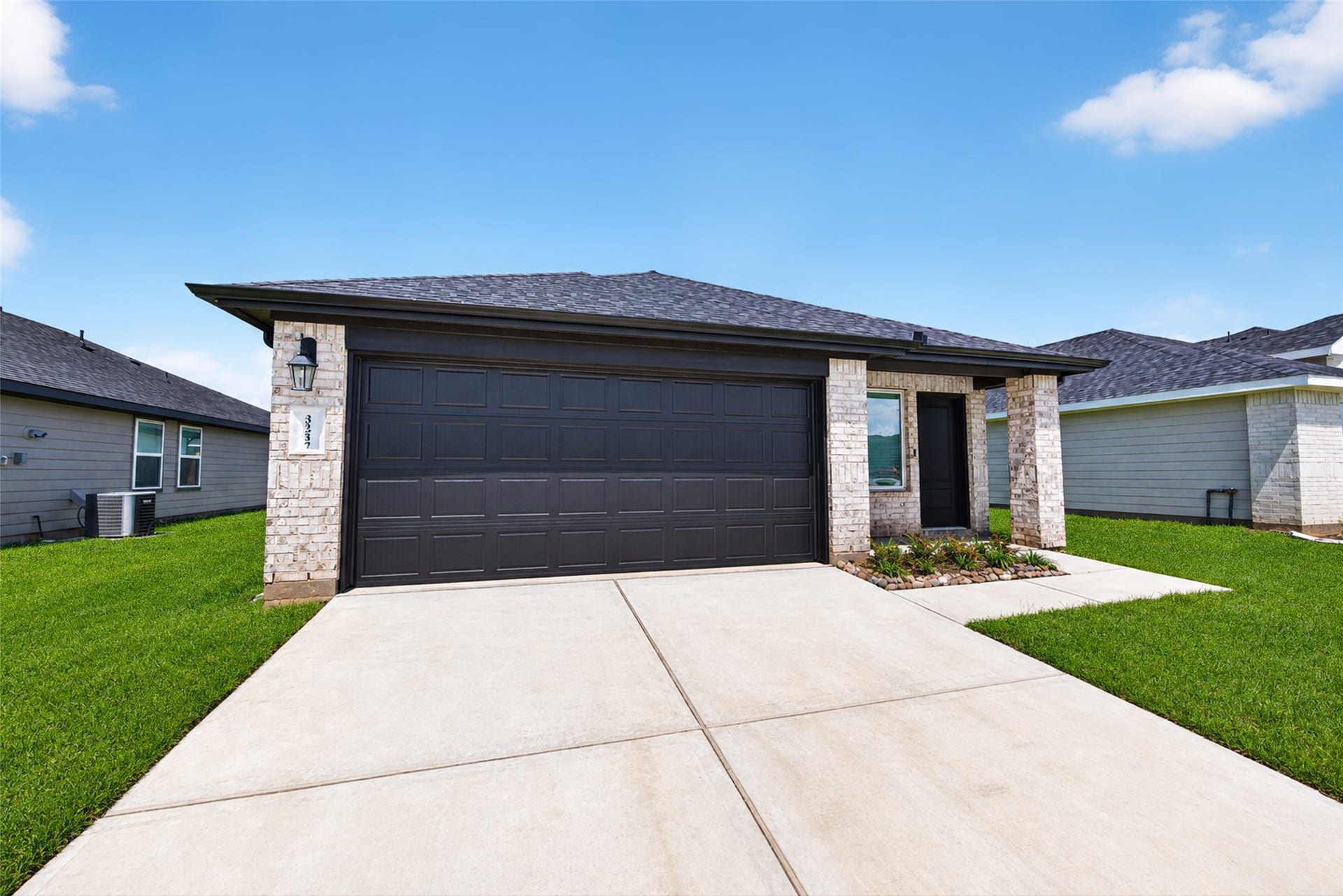 31214 Carmelas Landing Drive, Fulshear, TX 77441 View of garage and front door