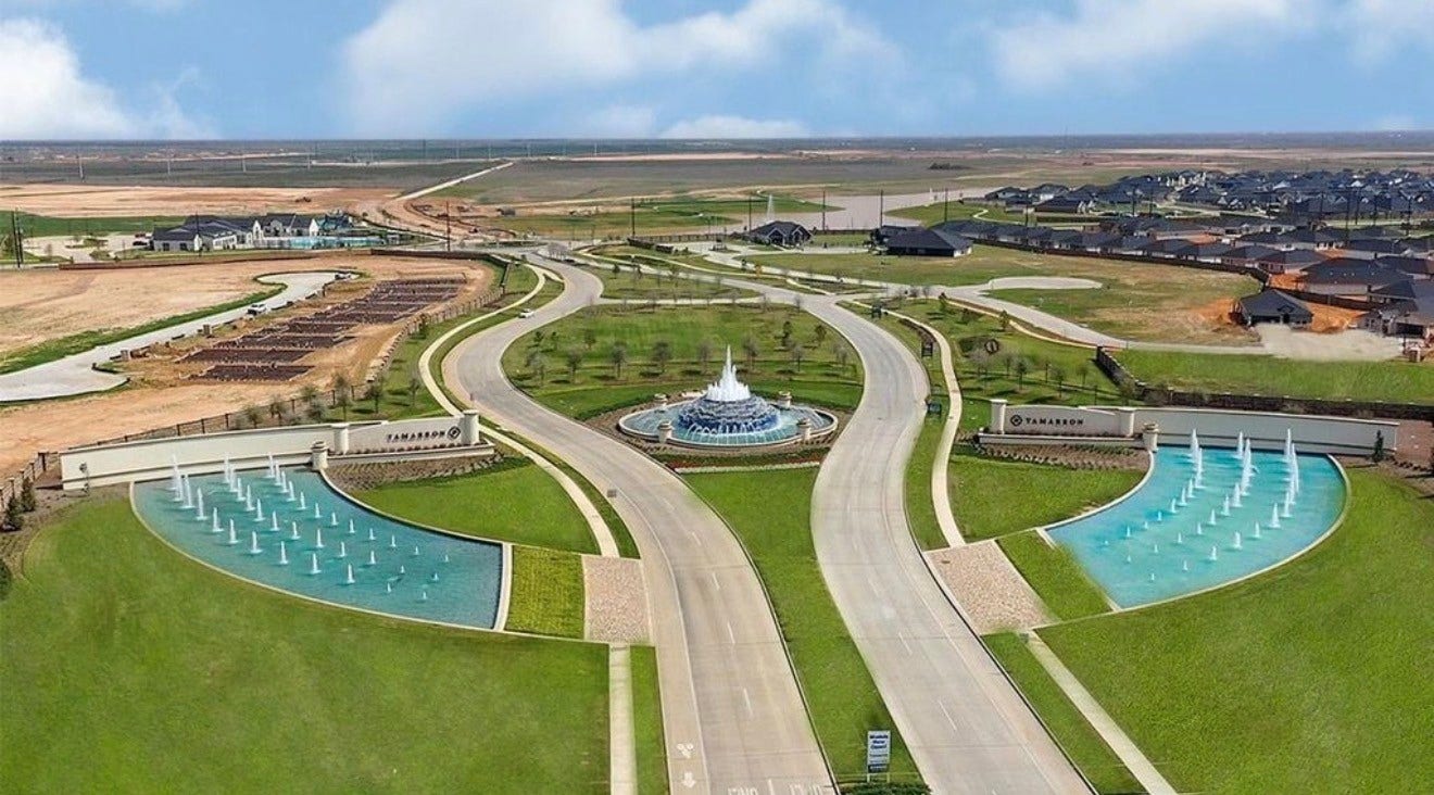 31214 Carmelas Landing Drive, Fulshear, TX 77441 Larger aerial view of community entrance.