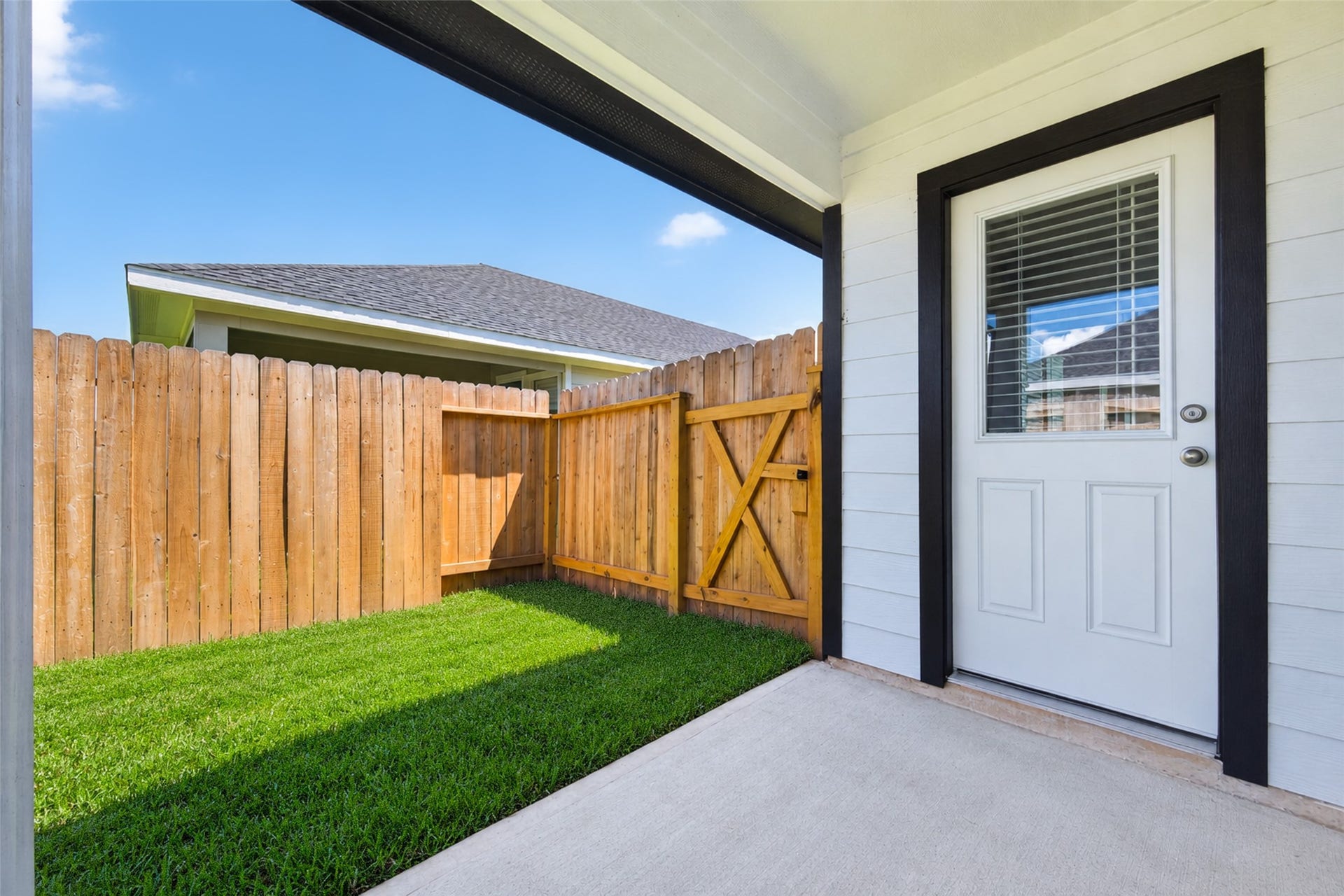 31214 Carmelas Landing Drive, Fulshear, TX 77441 View of covered patio and backdoor