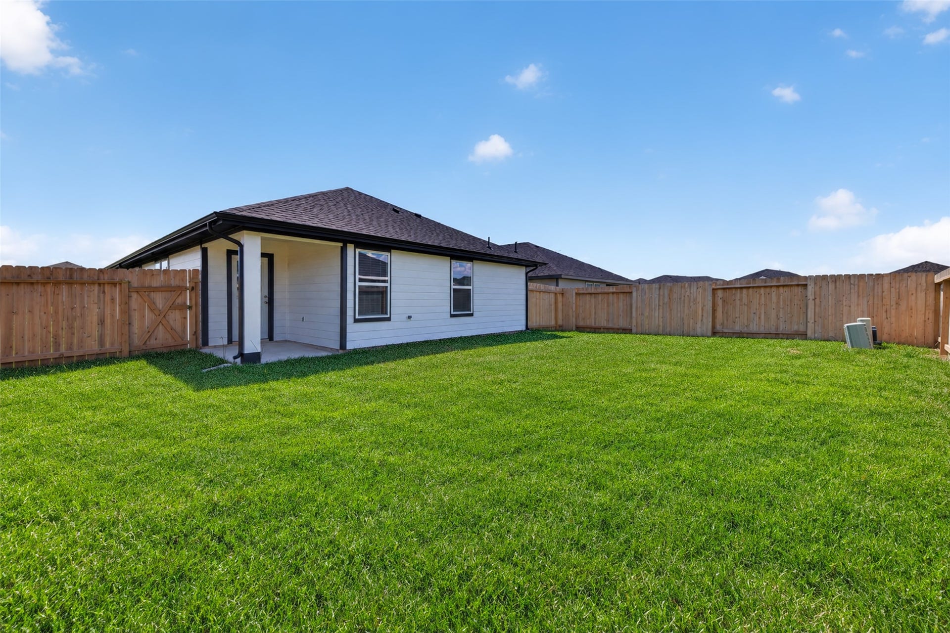31214 Carmelas Landing Drive, Fulshear, TX 77441 View of back of the home and spacious backyard