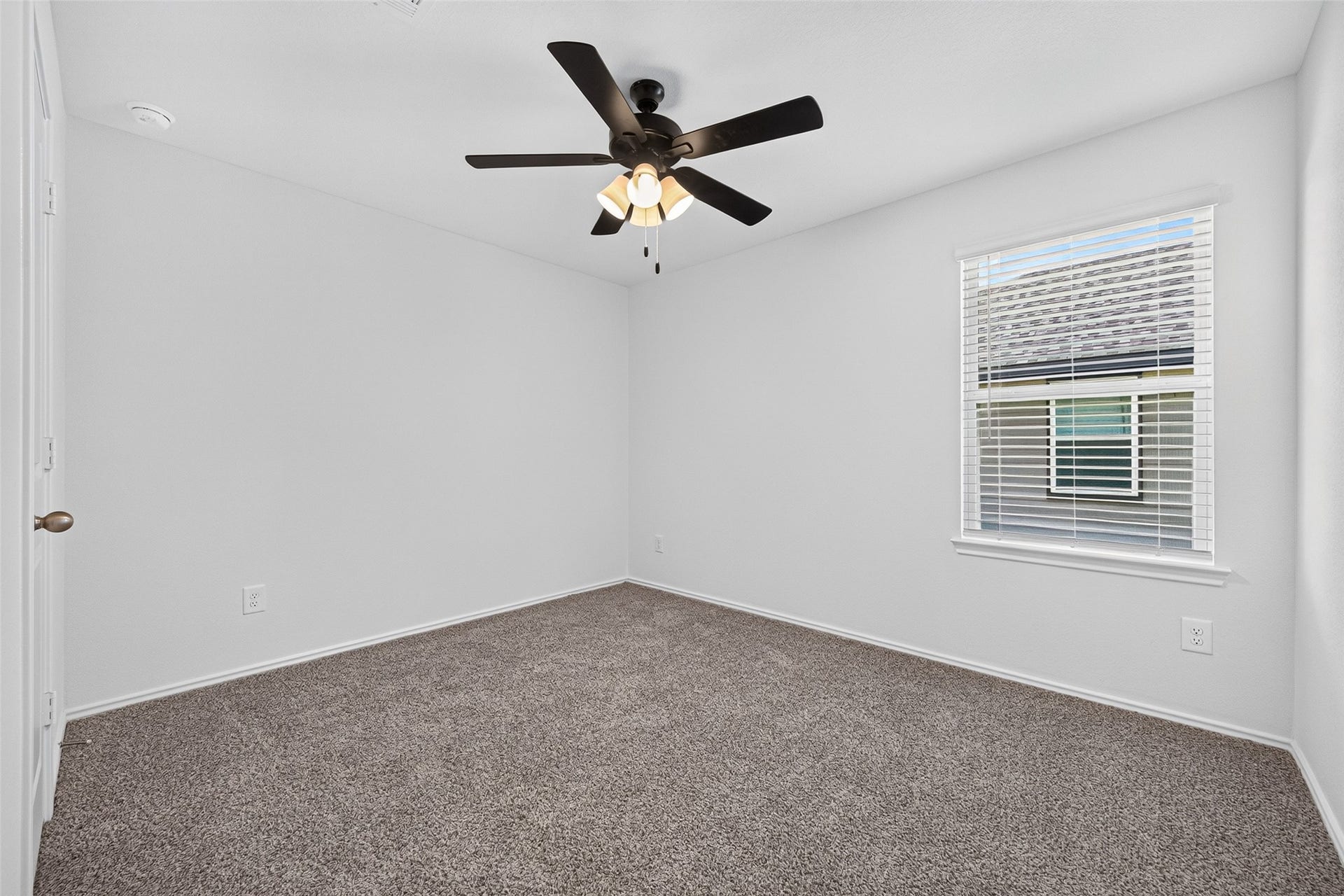 31214 Carmelas Landing Drive, Fulshear, TX 77441 Secondary bedroom with new carpet, ceiling fan and window blind