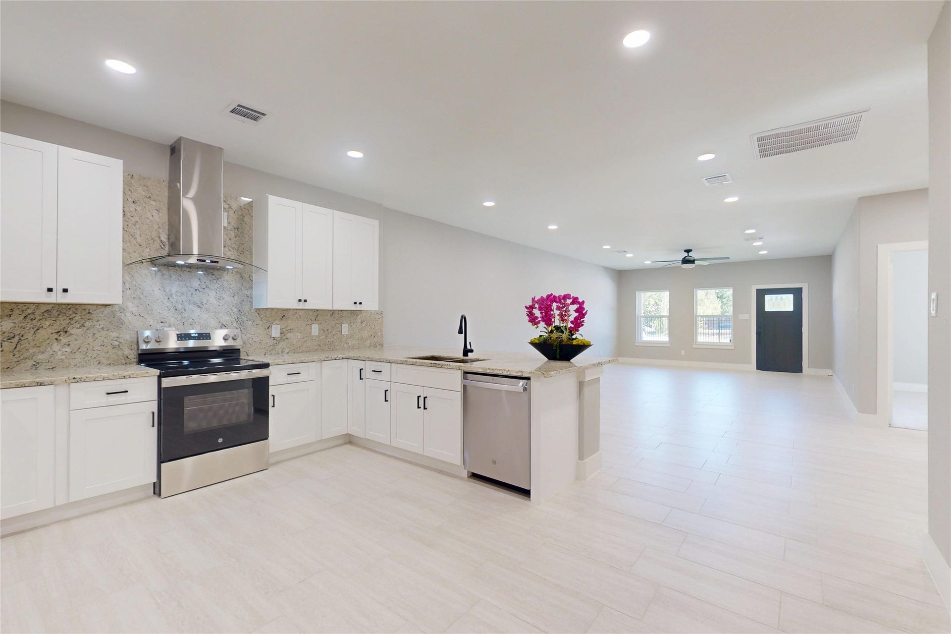 8709 Wheatley Street, Houston, TX 77088 Unit A: Modern kitchen featuring granite countertops, stainless steel appliances, and ample cabinetry.