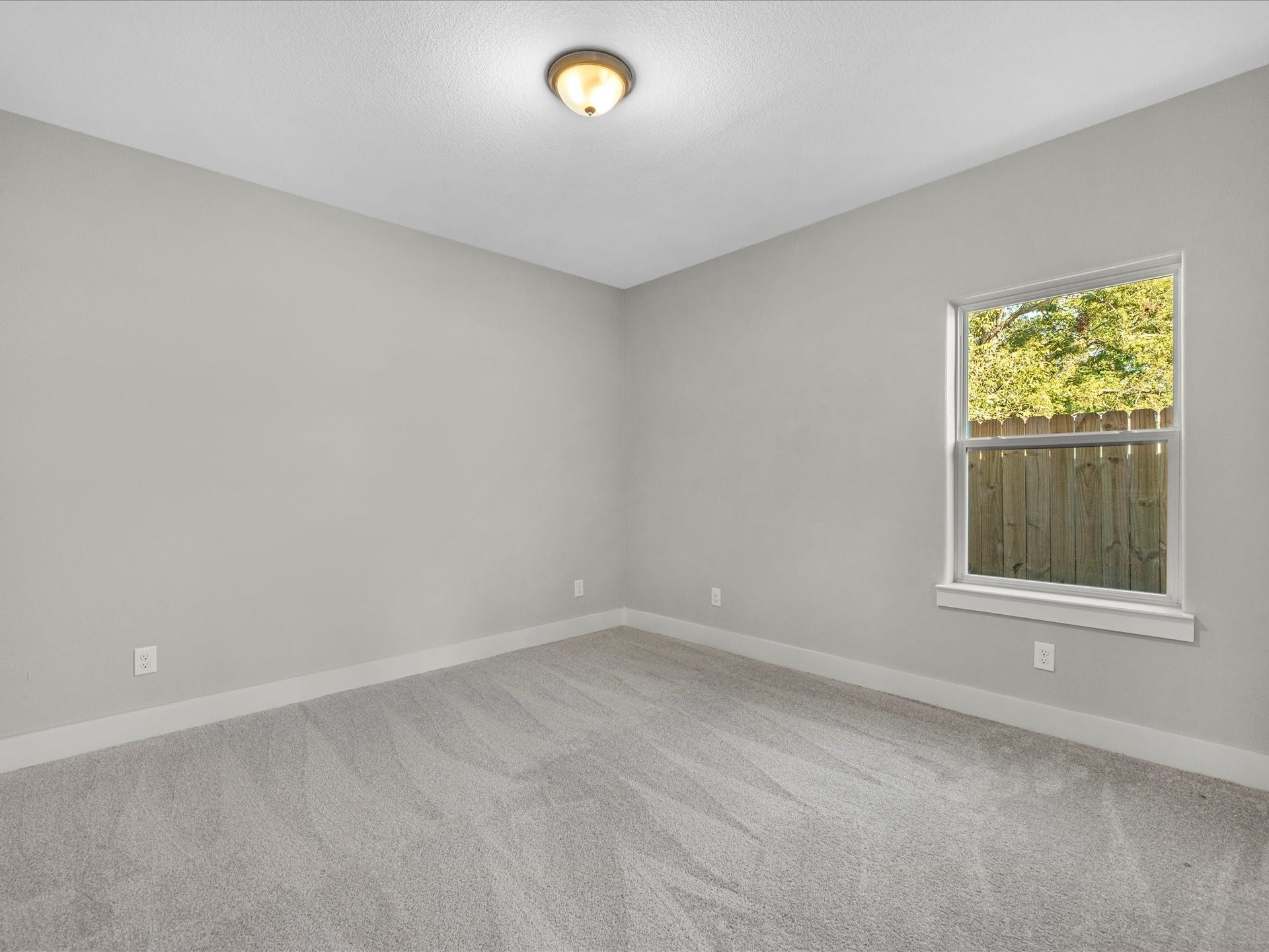 8709 Wheatley Street, Houston, TX 77088 Unit B: Comfortable secondary bedroom with neutral finishes and natural light.