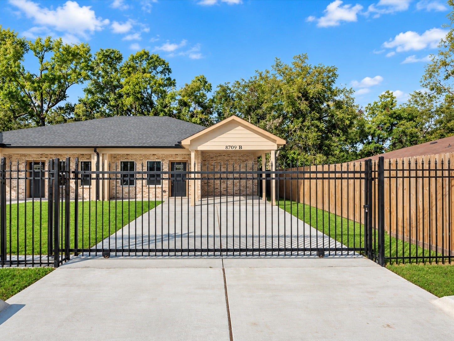 8709 Wheatley Street, Houston, TX 77088 Unit B: Separate gated driveway and covered entrance for independent living.