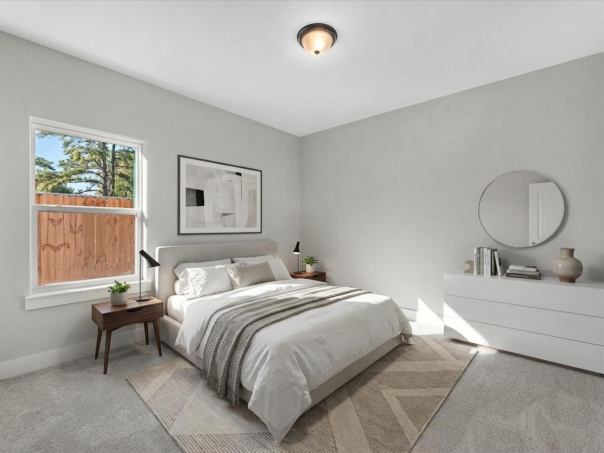 8709 Wheatley Street, Houston, TX 77088 Unit A: Virtually staged secondary bedroom showcasing a comfortable, versatile layout.