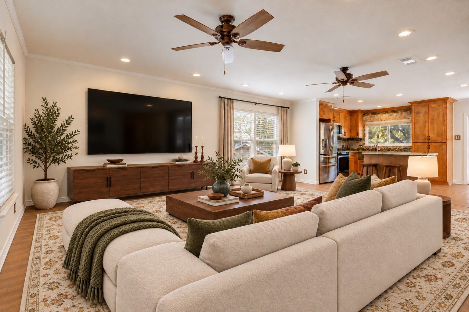 As you go upstairs, you have a very spacious living room with lots of natural light and open to the kitchen *virtually staged*