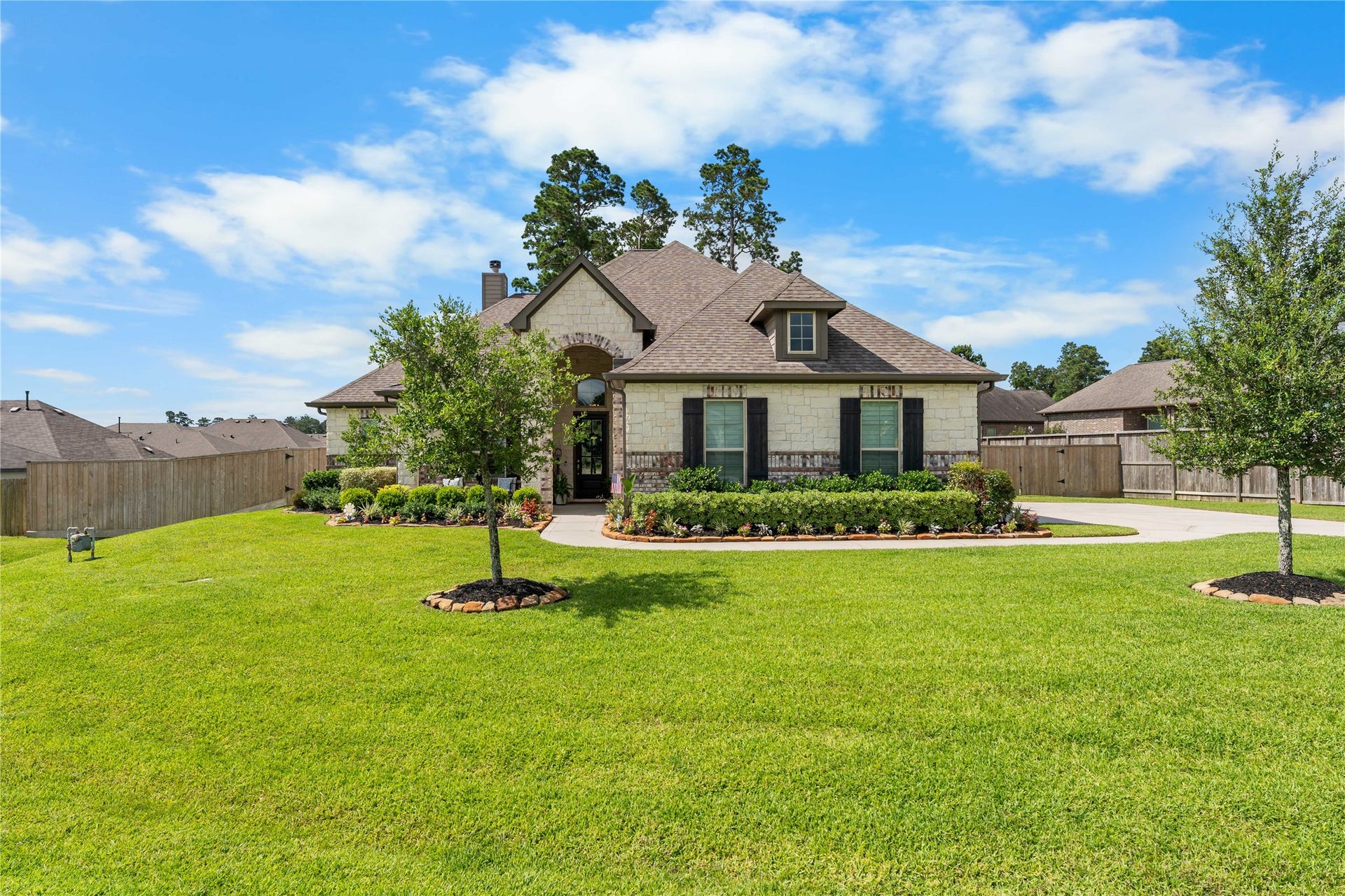 40803 Mostyn Drive, Magnolia, TX 77354 Expansive front yard with mature landscaping and elevated curb appeal.