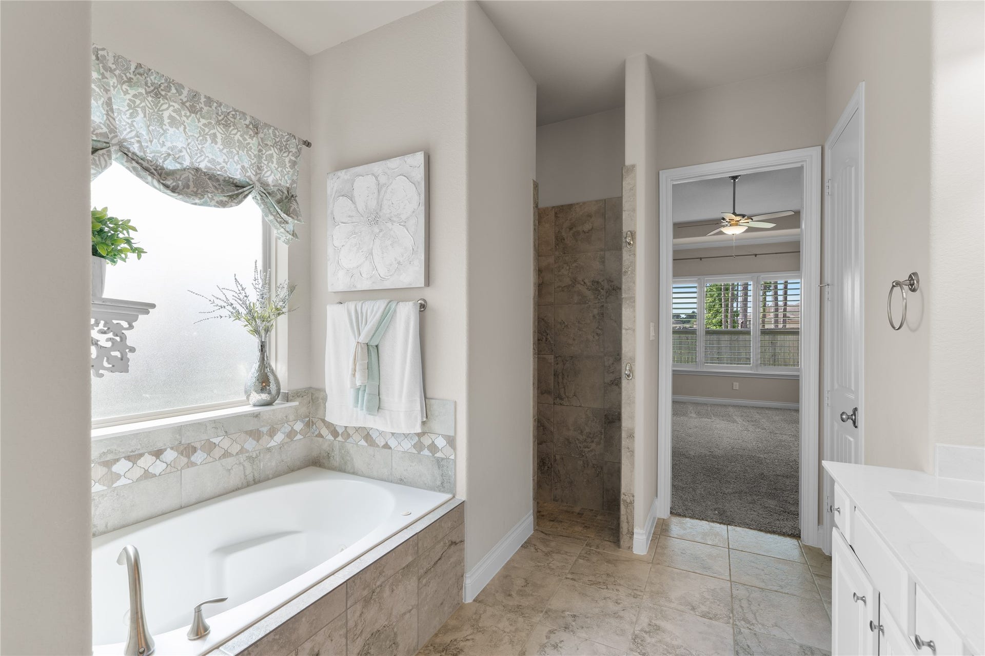 40803 Mostyn Drive, Magnolia, TX 77354 Primary bath featuring a soaking tub and large walk-in shower.