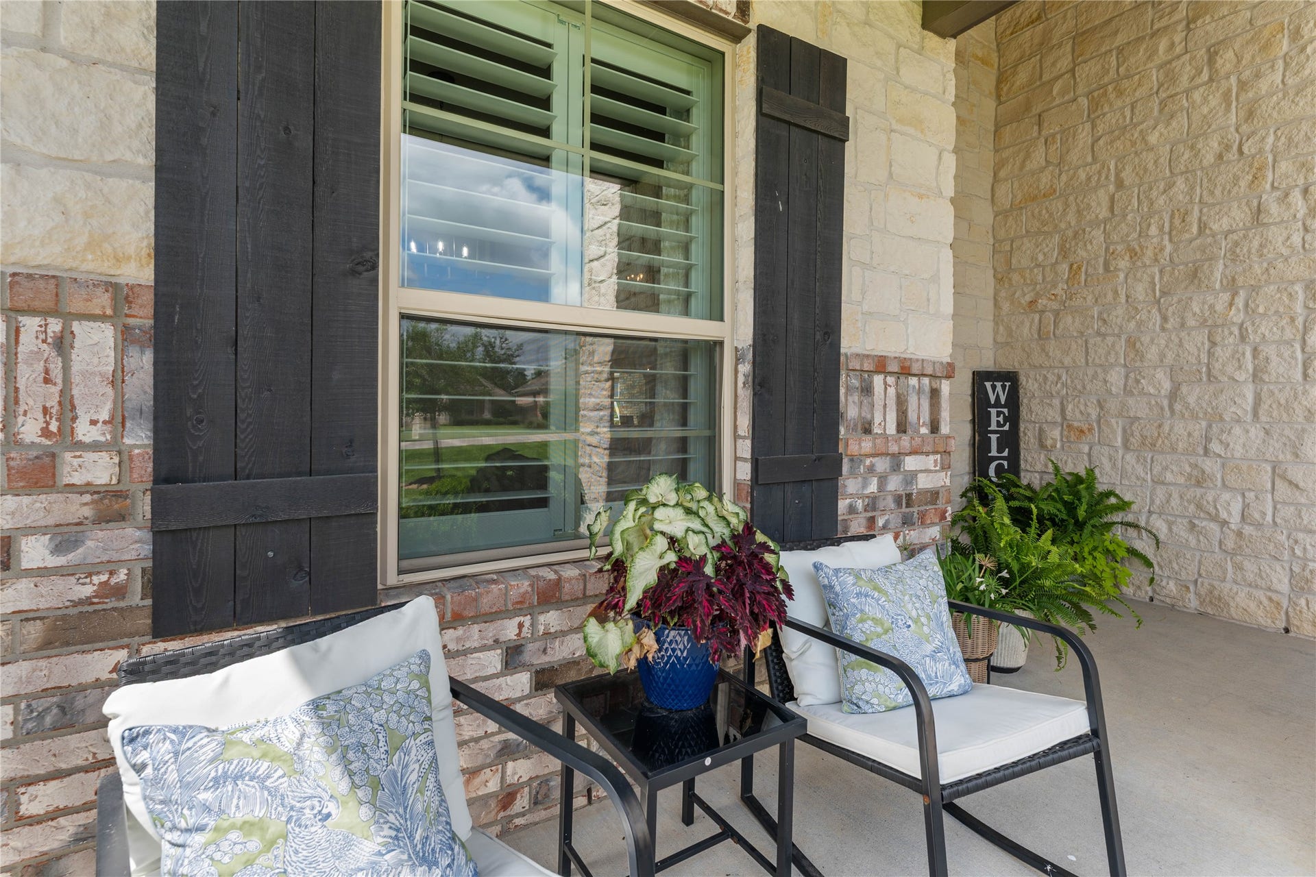 40803 Mostyn Drive, Magnolia, TX 77354 Covered front porch offers a welcoming place to relax and unwind