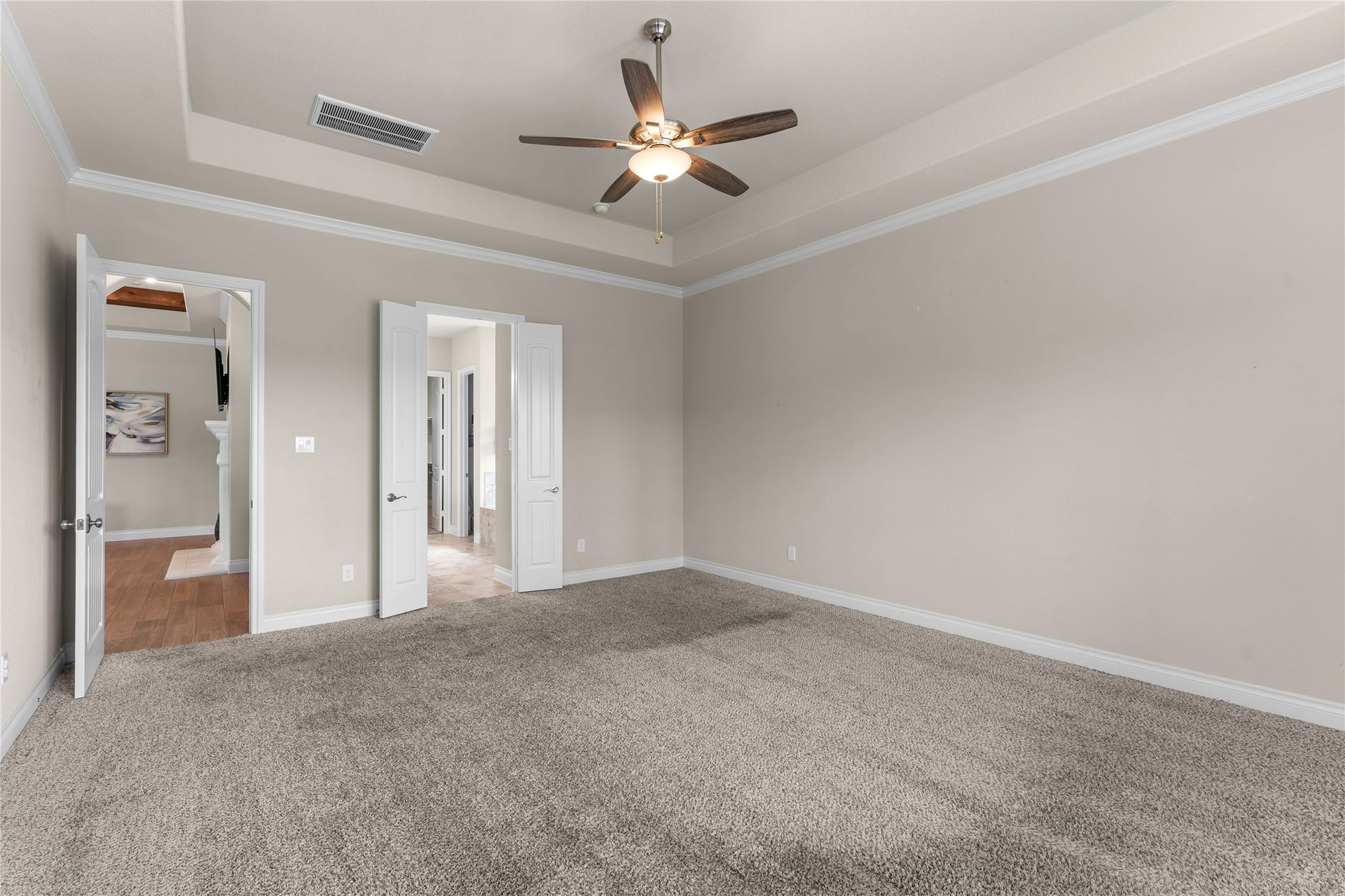 40803 Mostyn Drive, Magnolia, TX 77354 Oversized primary bedroom with tray ceilings and room to unwind.