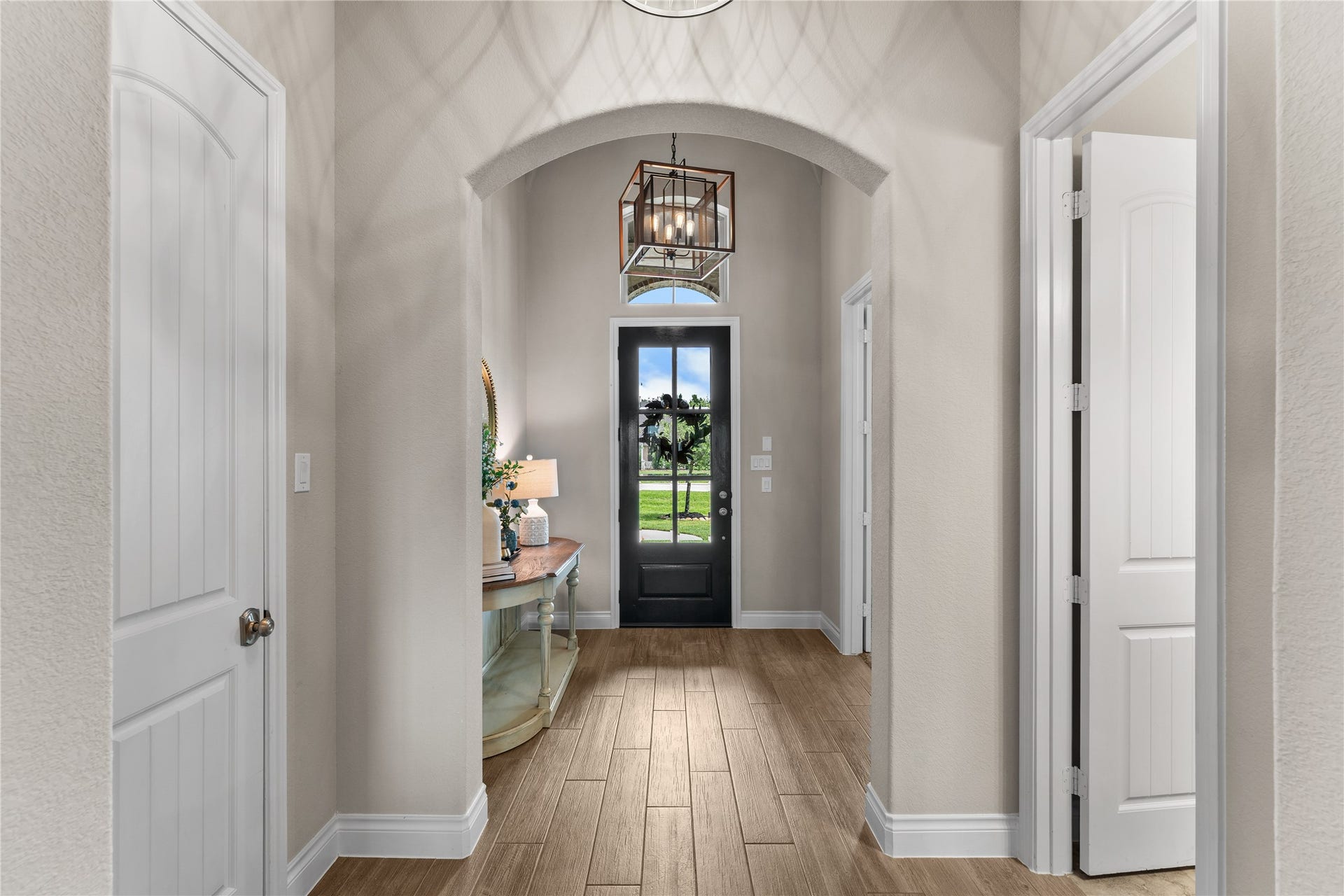 40803 Mostyn Drive, Magnolia, TX 77354 Inviting entry with architectural details and warm natural light throughout
