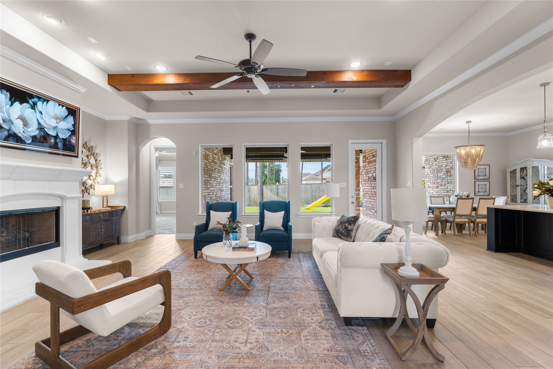 40803 Mostyn Drive, Magnolia, TX 77354 Spacious family room centered around custom ceiling details and a cozy fireplace