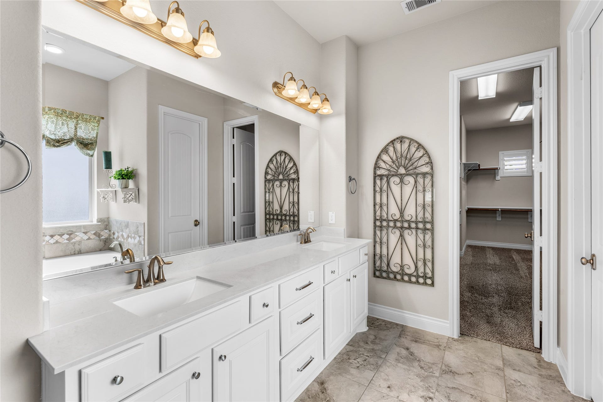 40803 Mostyn Drive, Magnolia, TX 77354 Elegant primary bathroom designed for comfort and functionality.