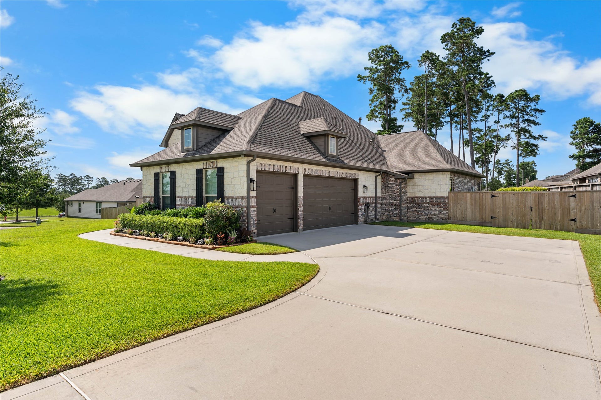 40803 Mostyn Drive, Magnolia, TX 77354 Extended driveway and side-entry garage create a polished first impression