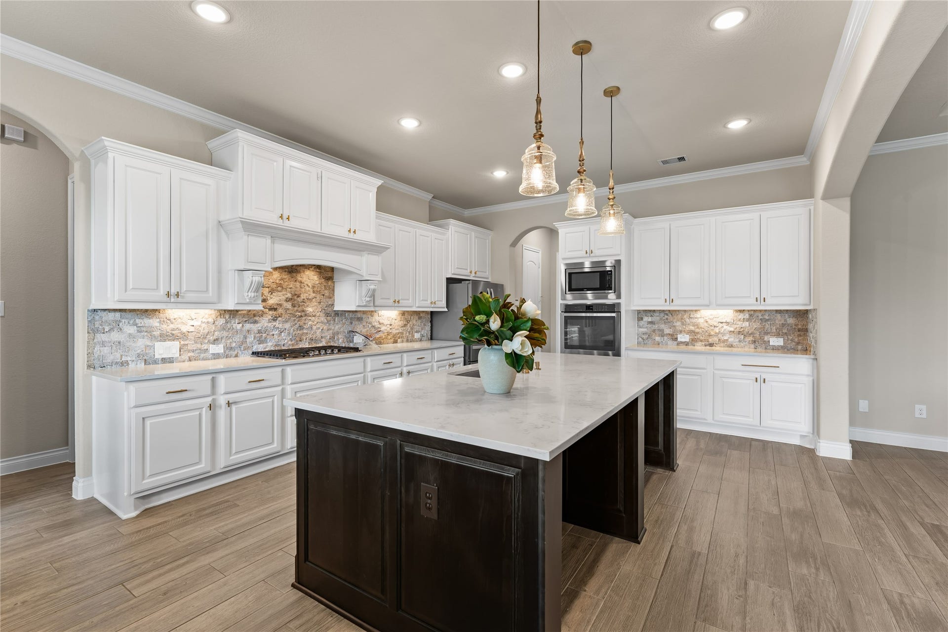 40803 Mostyn Drive, Magnolia, TX 77354 Bright chefs kitchen featuring extensive cabinetry and open sightlines
