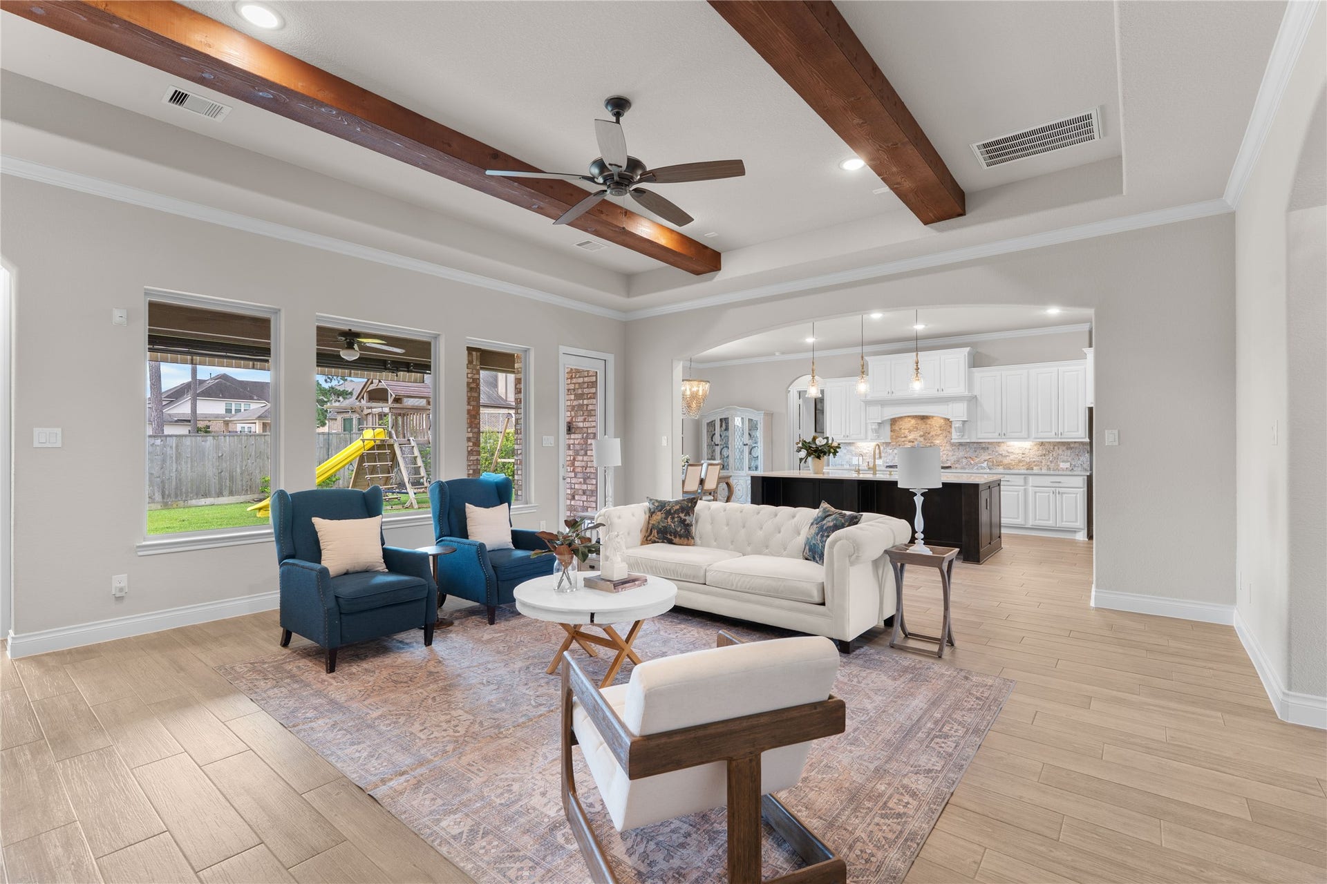 40803 Mostyn Drive, Magnolia, TX 77354 Light-filled living and dining areas with a refined, modern feel