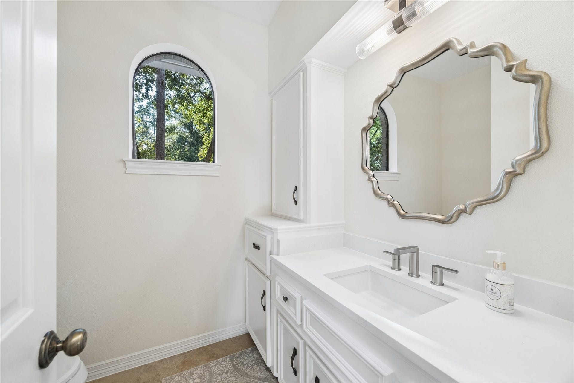 The second half bathroom showcasing a delightful design and lots of natural light with a lot of privacy