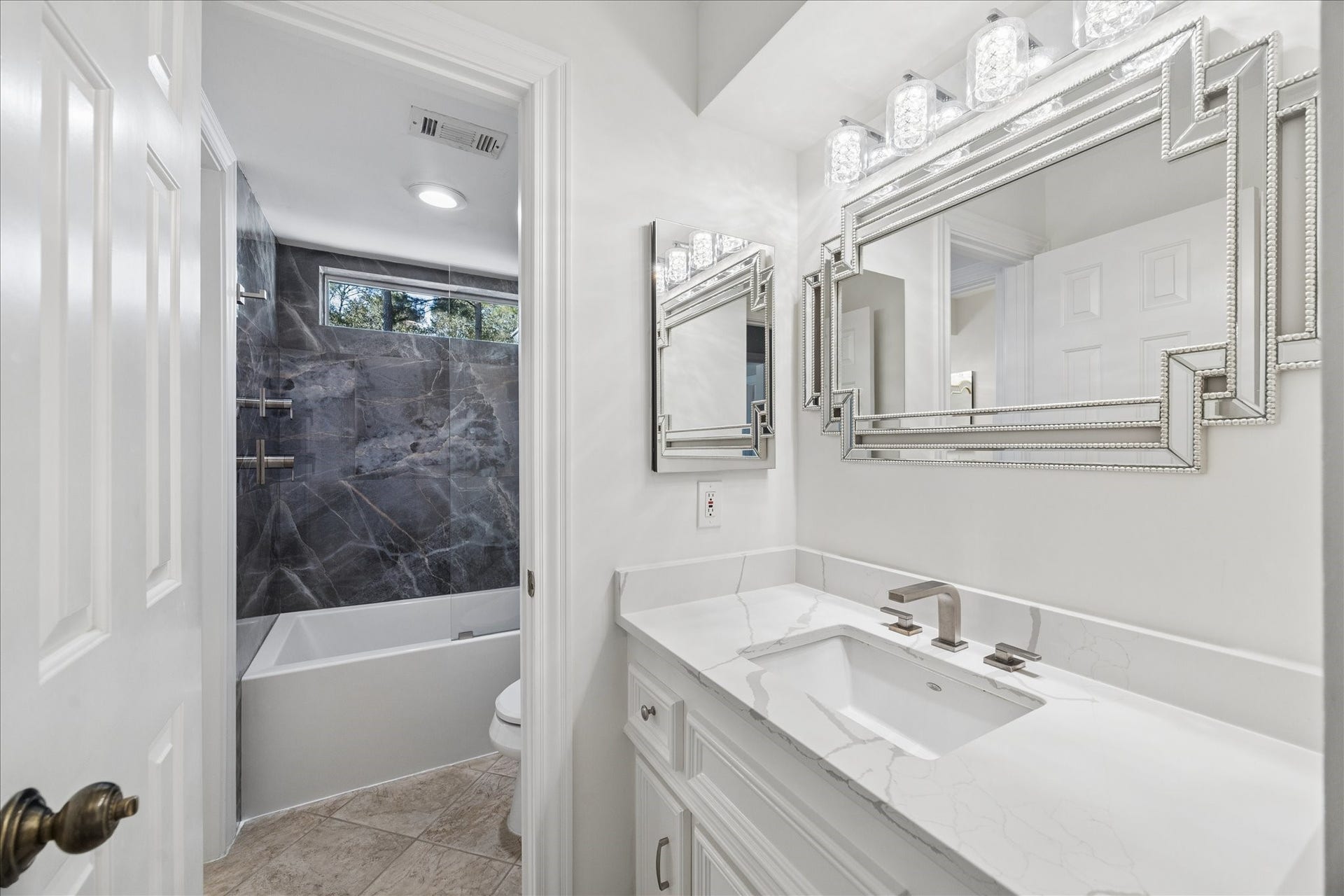 Beautifully Jack and Jill bathroom designed with timeless appeal. The walls in this tub are delightfully design with stone walls.