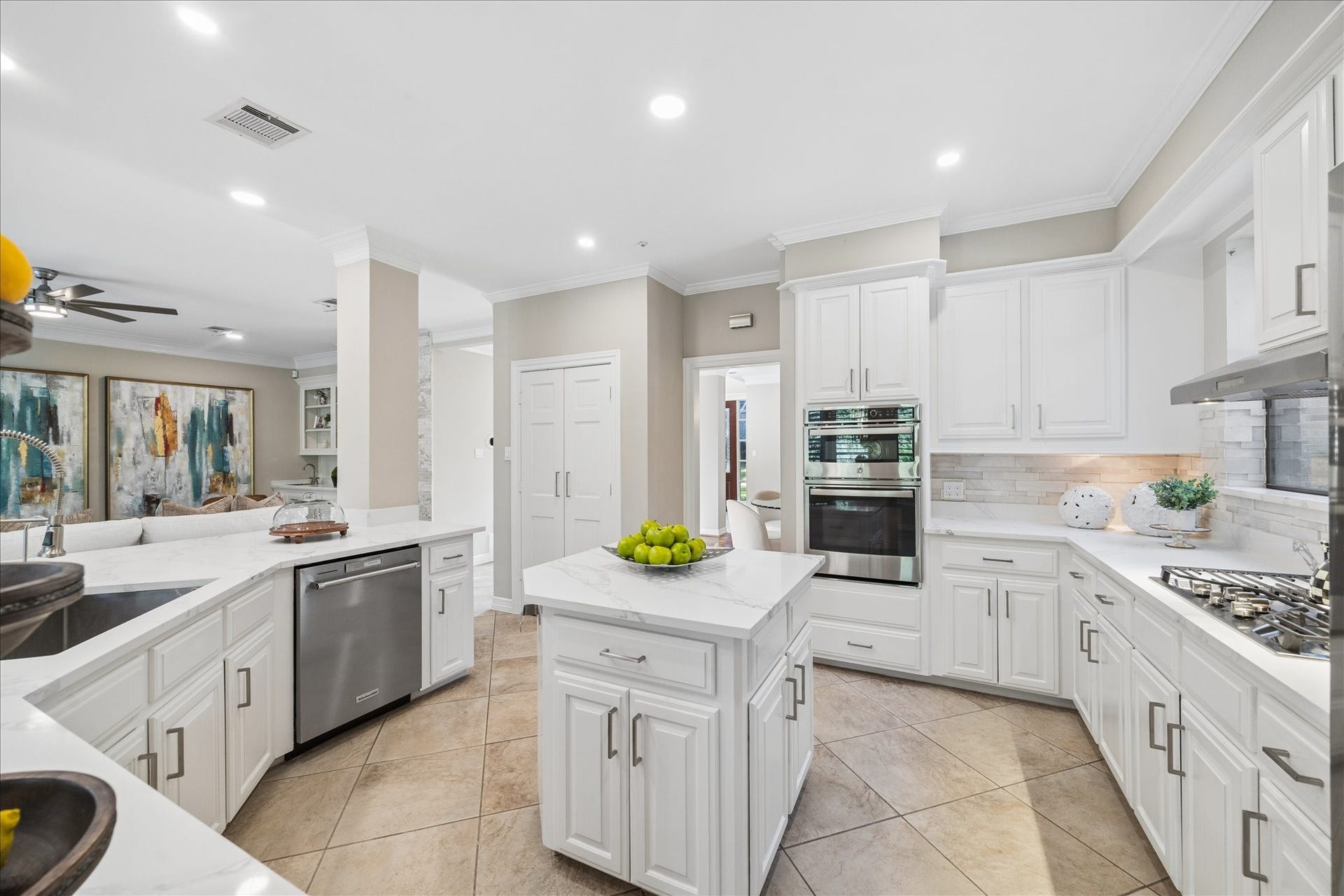 Extensively updated kitchen featuring a generous island, abundant storage, and modern finishes.