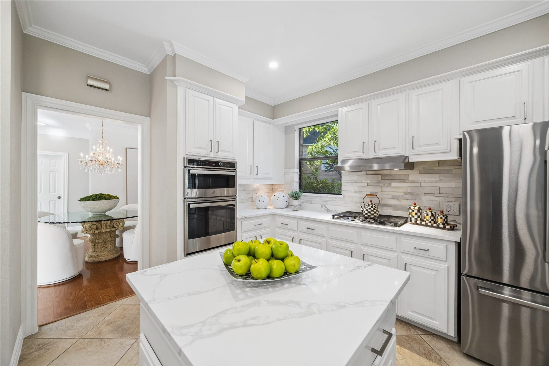 The kitchen showcasing quality updates, newer appliances including the refrigerator.