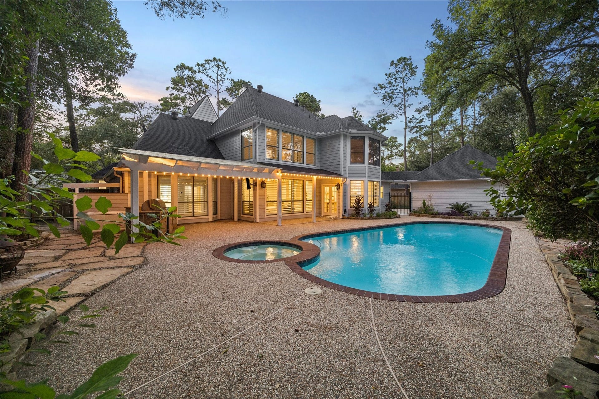 Resort-style backyard featuring pool, outdoor entertaining areas, and mature landscaping. Whole house generator bringing peace of mind.
