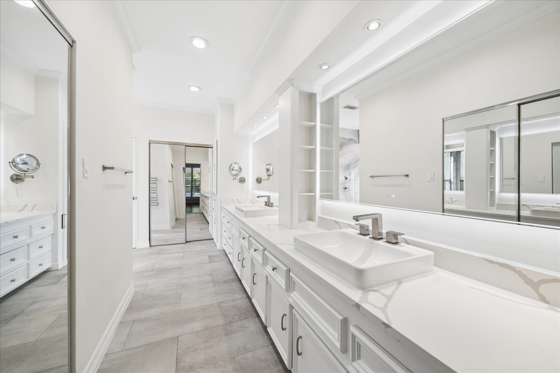 Spa-inspired primary bath with dual vanities and extensive updates.