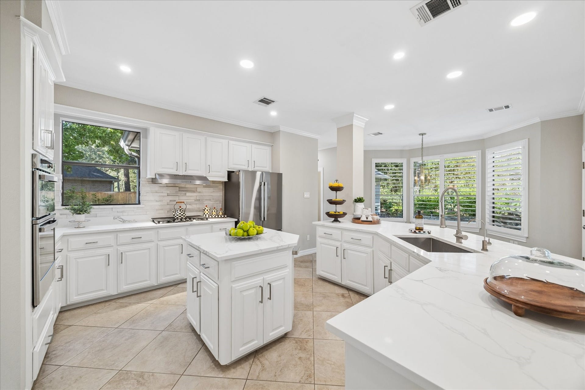 Designer-inspired kitchen showcasing quality updates and exceptional functionality. Quartz Countertops and seamless work flow.