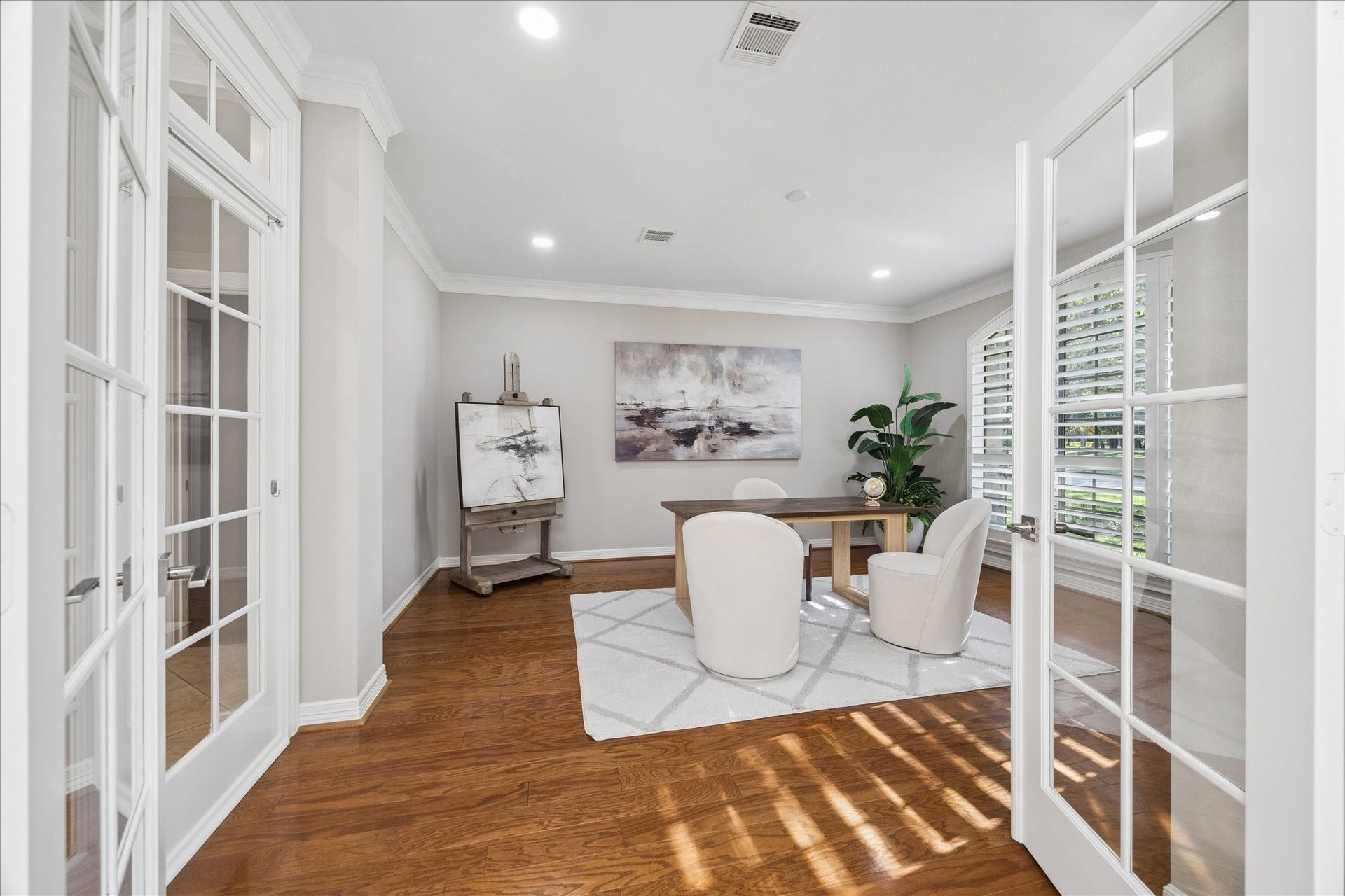 Private flex room enclosed by custom french doors and filled with natural light.