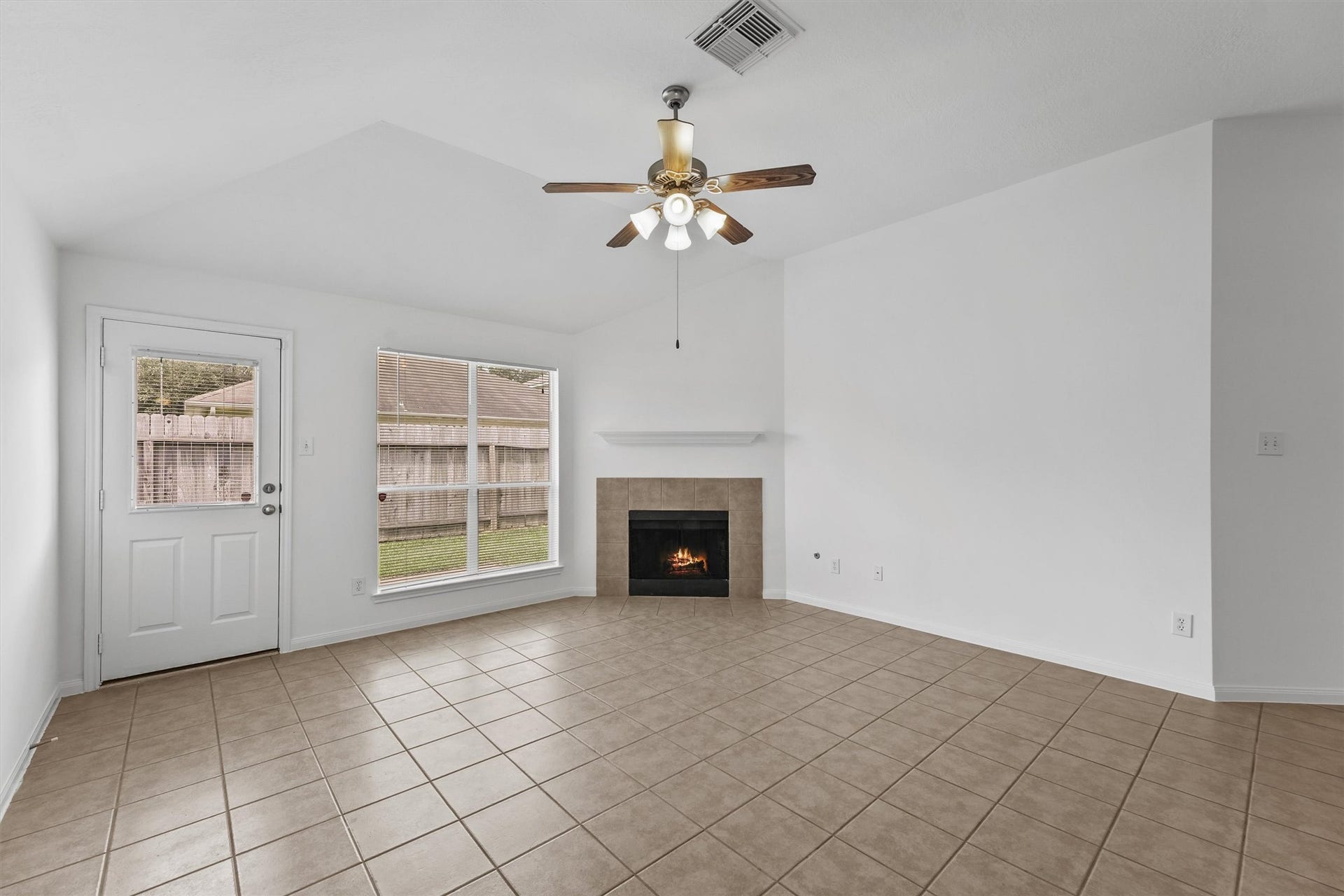 There is NO CARPET in this home. But there is a fireplace and high ceilings.