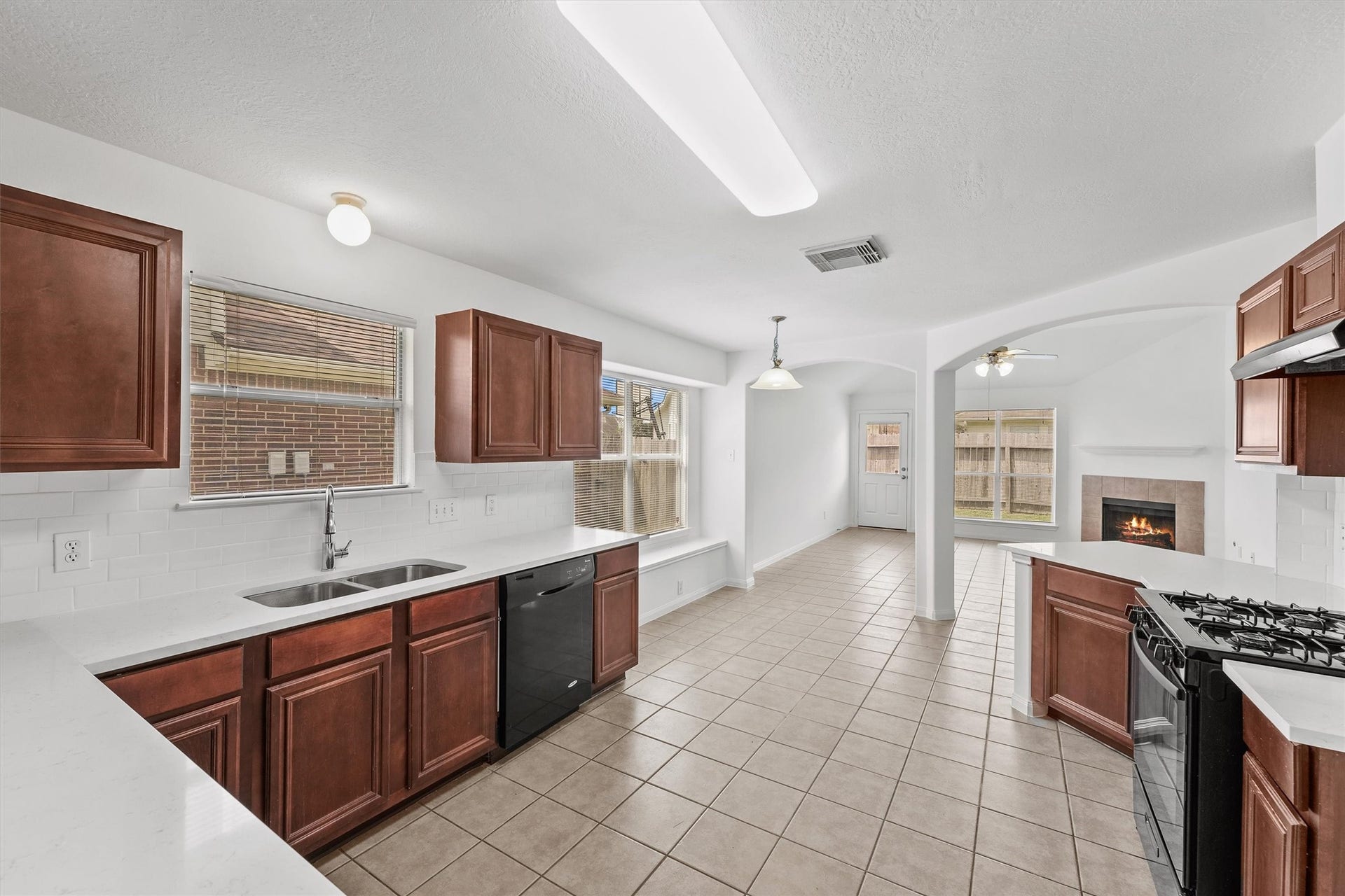 New countertops and open concept living are ready for daily life and entertaining.